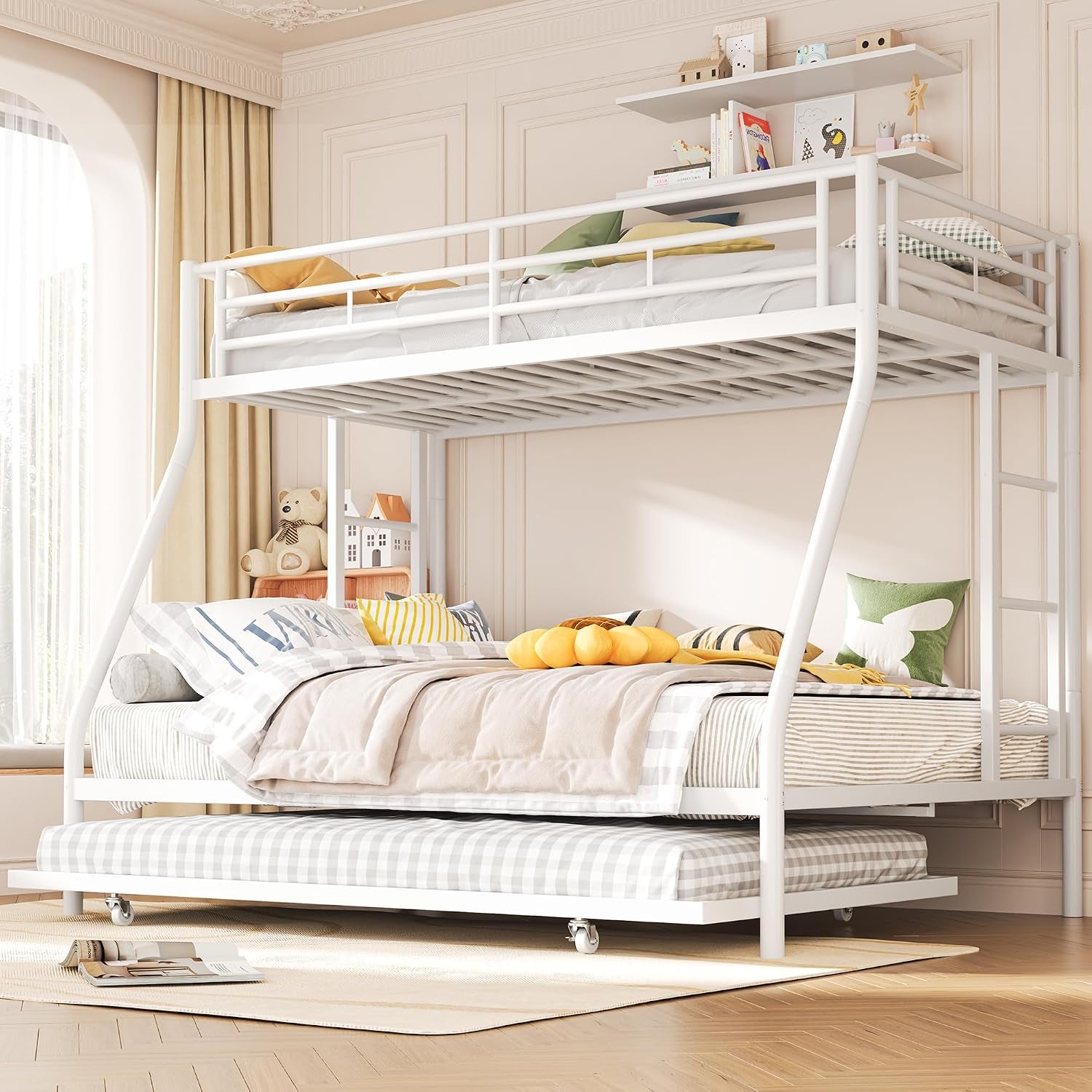 White metal twin-over-full bunk bed styled in a bright bedroom with the trundle mattress pulled out.