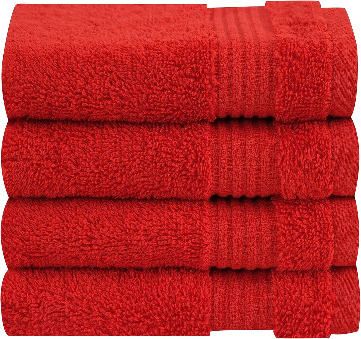 Side-on close stack of vibrant red towels highlighting looped pile and ribbed trim