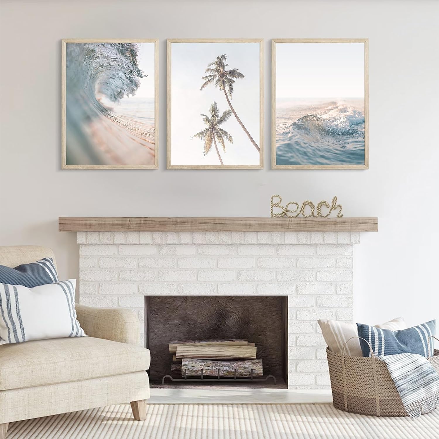 Living room wall above a white brick fireplace showing three framed coastal prints of waves and palm trees.
