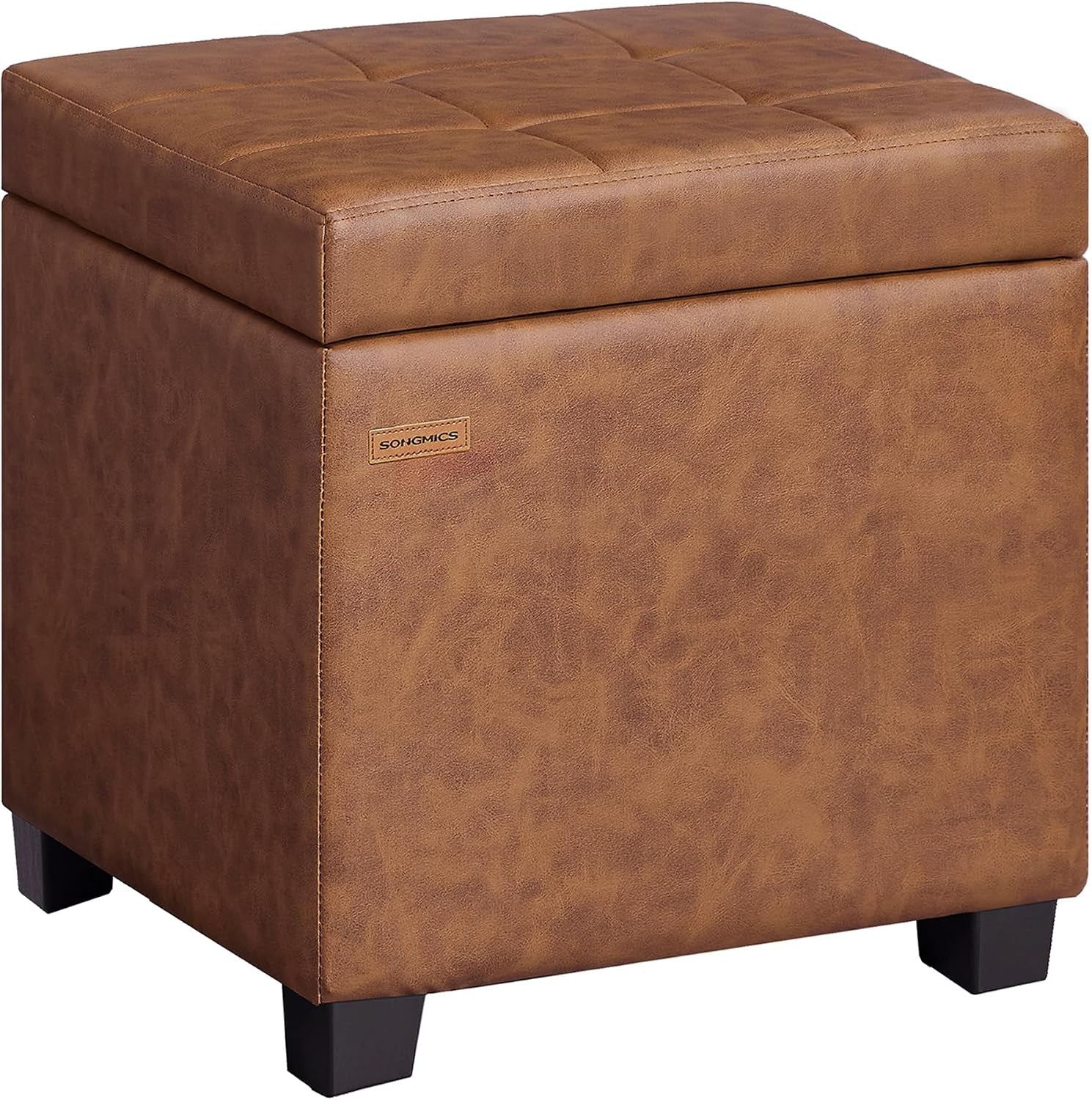 Square brown tufted storage ottoman with black block feet shown at an angle.