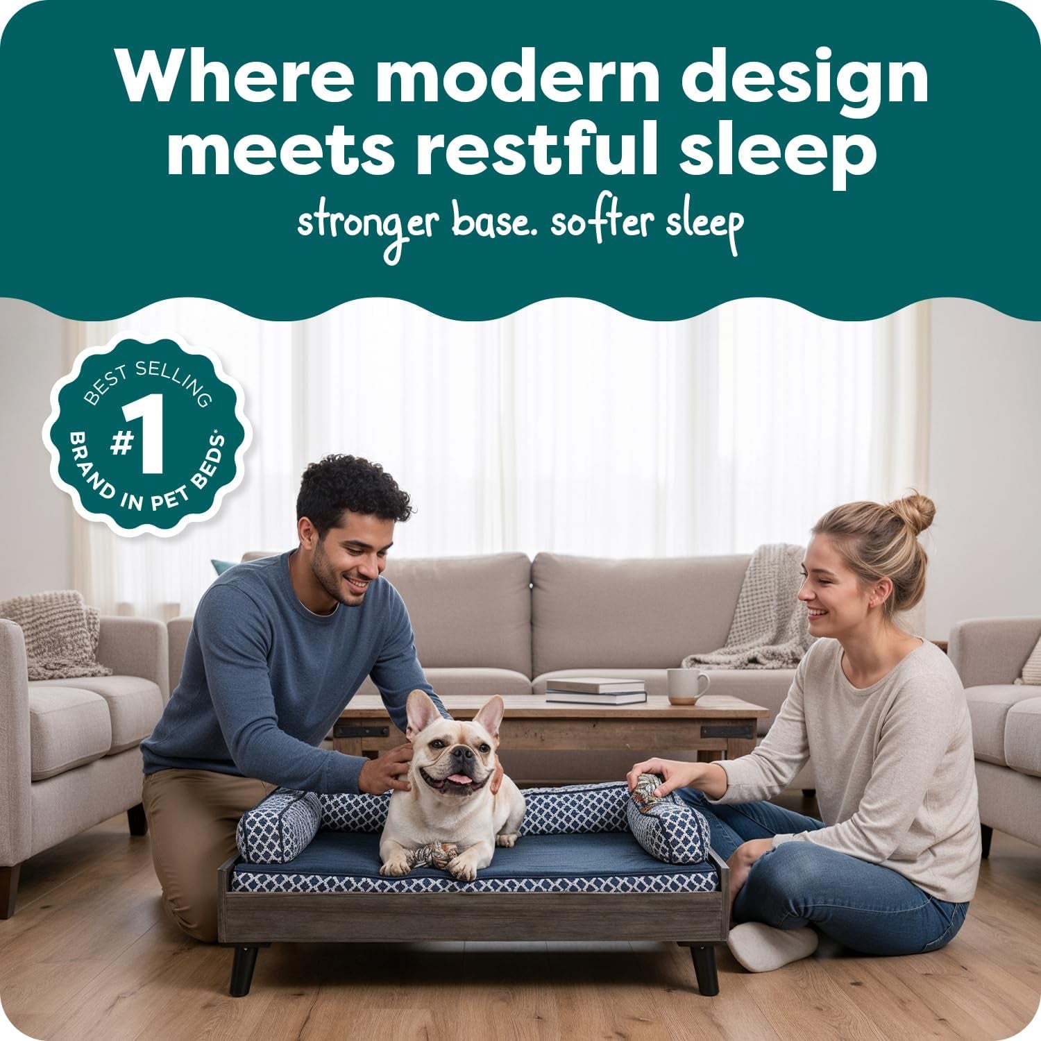 Gray-wash elevated dog bed styled in a living room with a dog and two people kneeling beside it