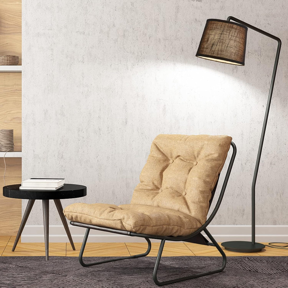 Black lamp shade on an arched floor lamp over a lounge chair in a living room setting