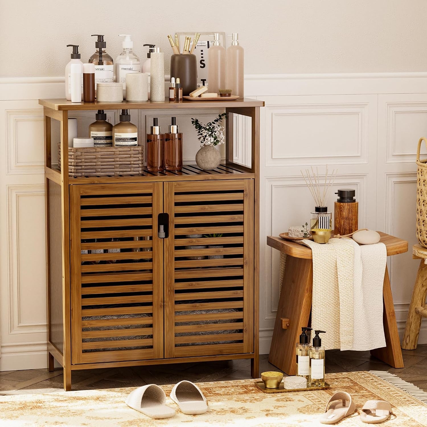 Bamboo storage cabinet in a bathroom setting with toiletries on the tabletop and items on the open shelf