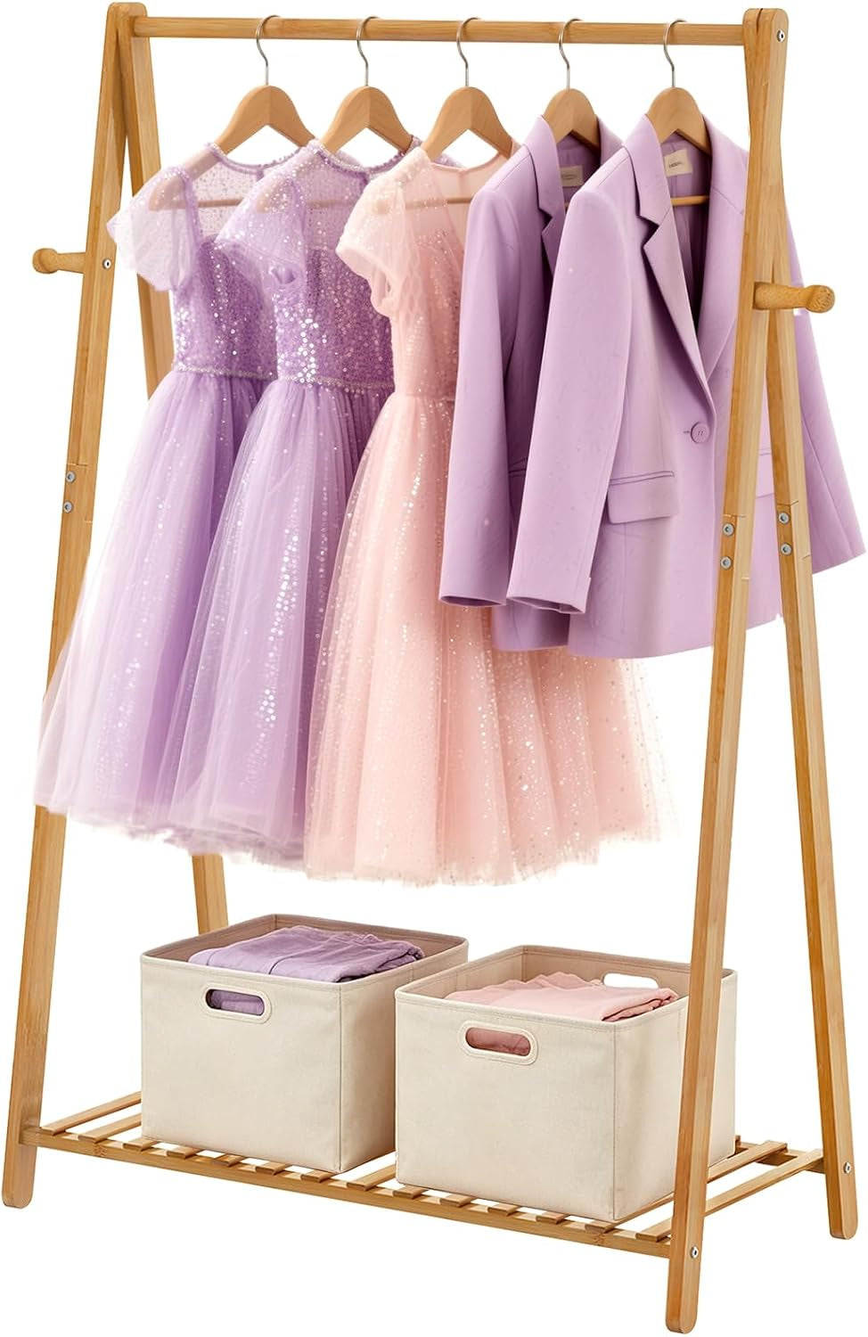 Bamboo kids garment rack with dresses, jackets and two fabric storage bins on the bottom shelf.