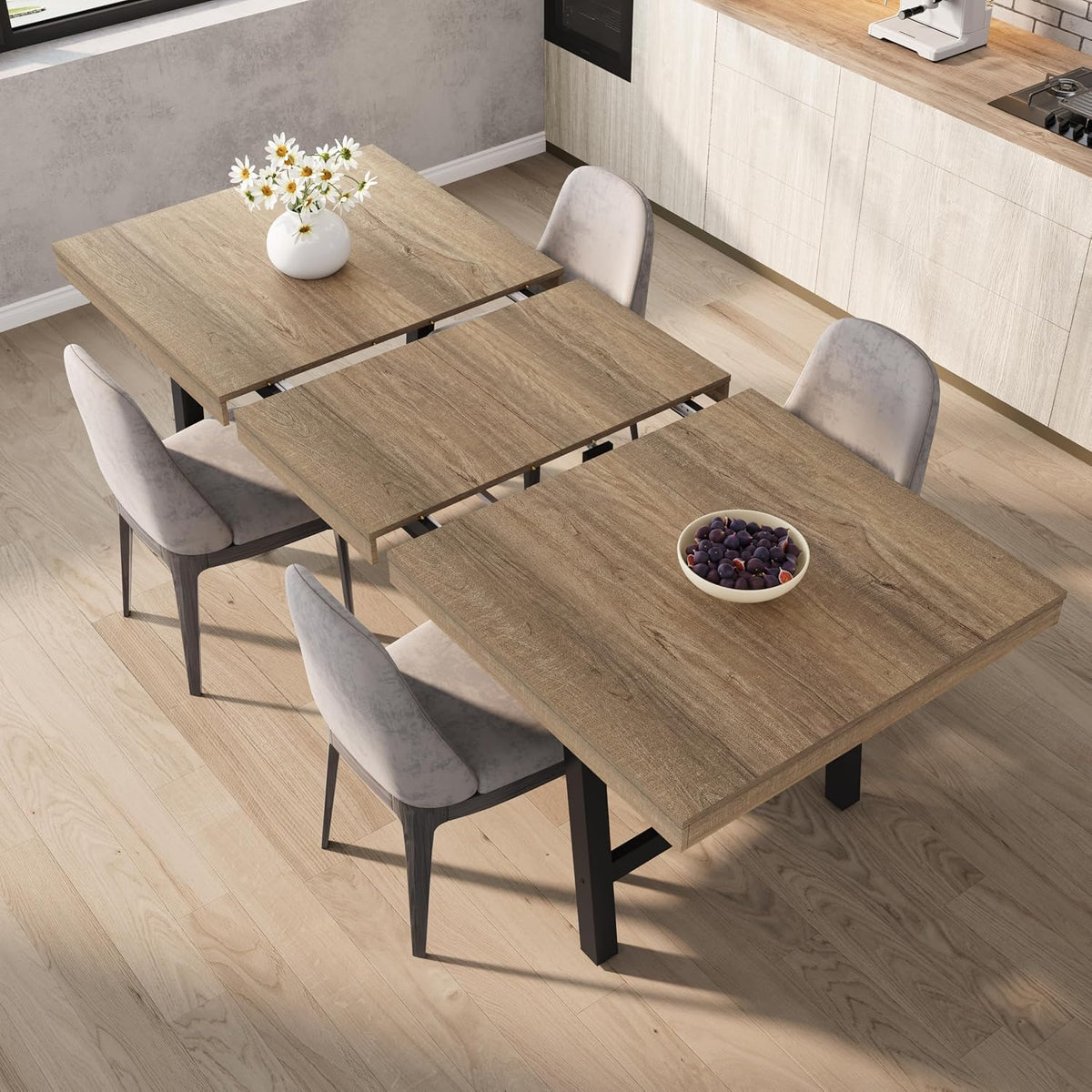 Top-down view of the table partially extended showing the butterfly leaf mechanism and mid-tone wood finish.