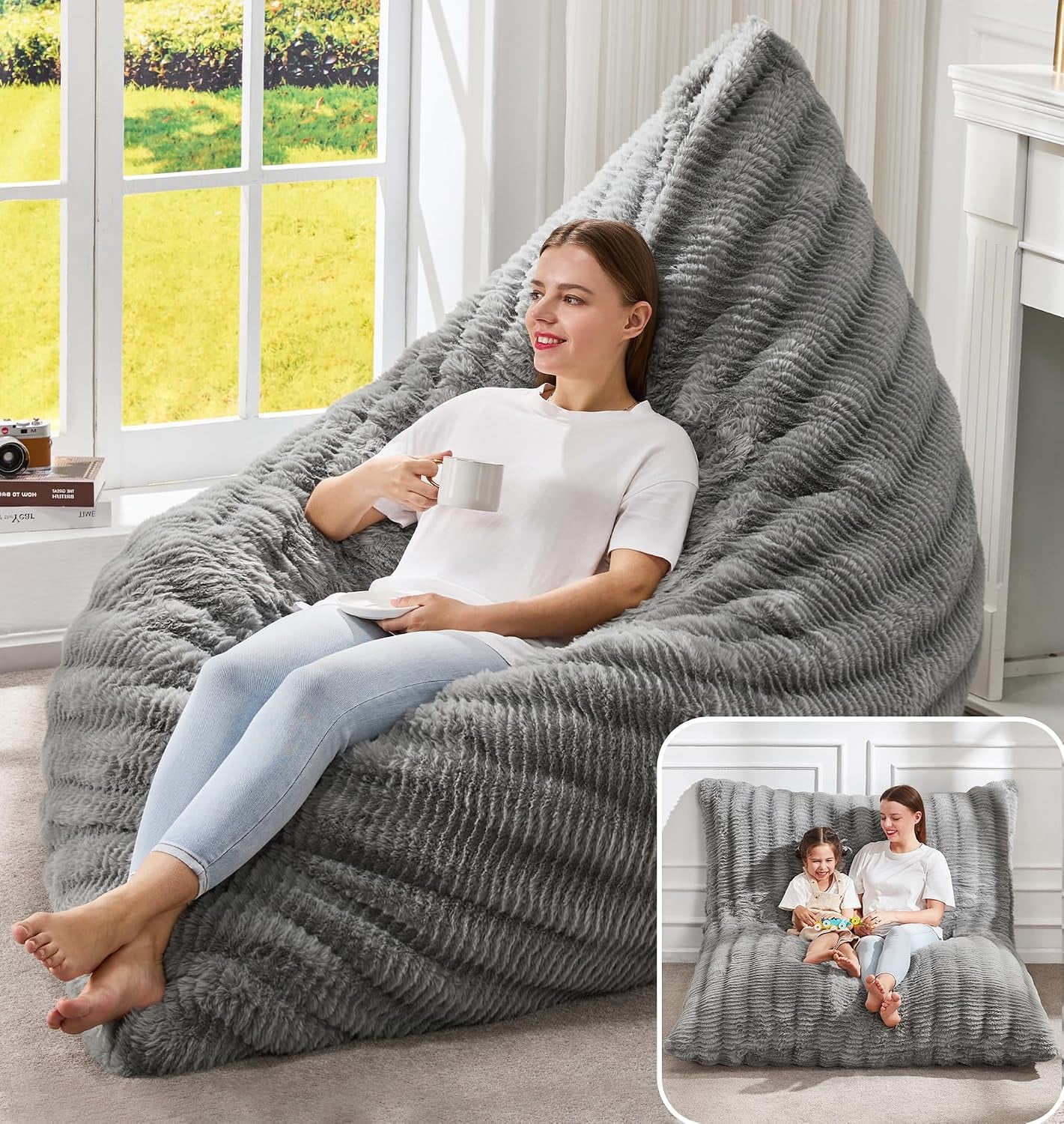 Textured medium gray beanbag lounger with a woman sipping from a mug near a window