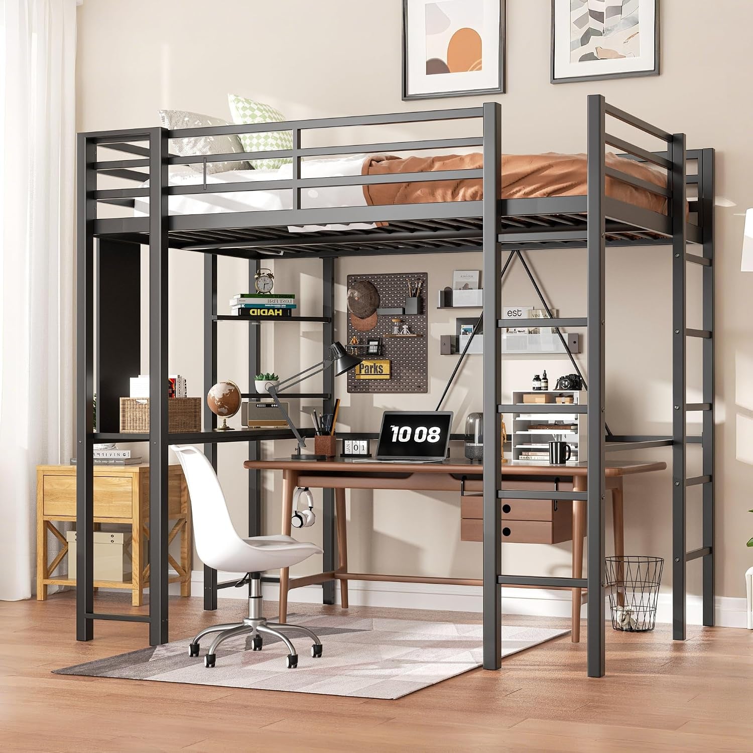 Black loft bed over a workspace with desk, chair, shelving and ladder in a bright room.