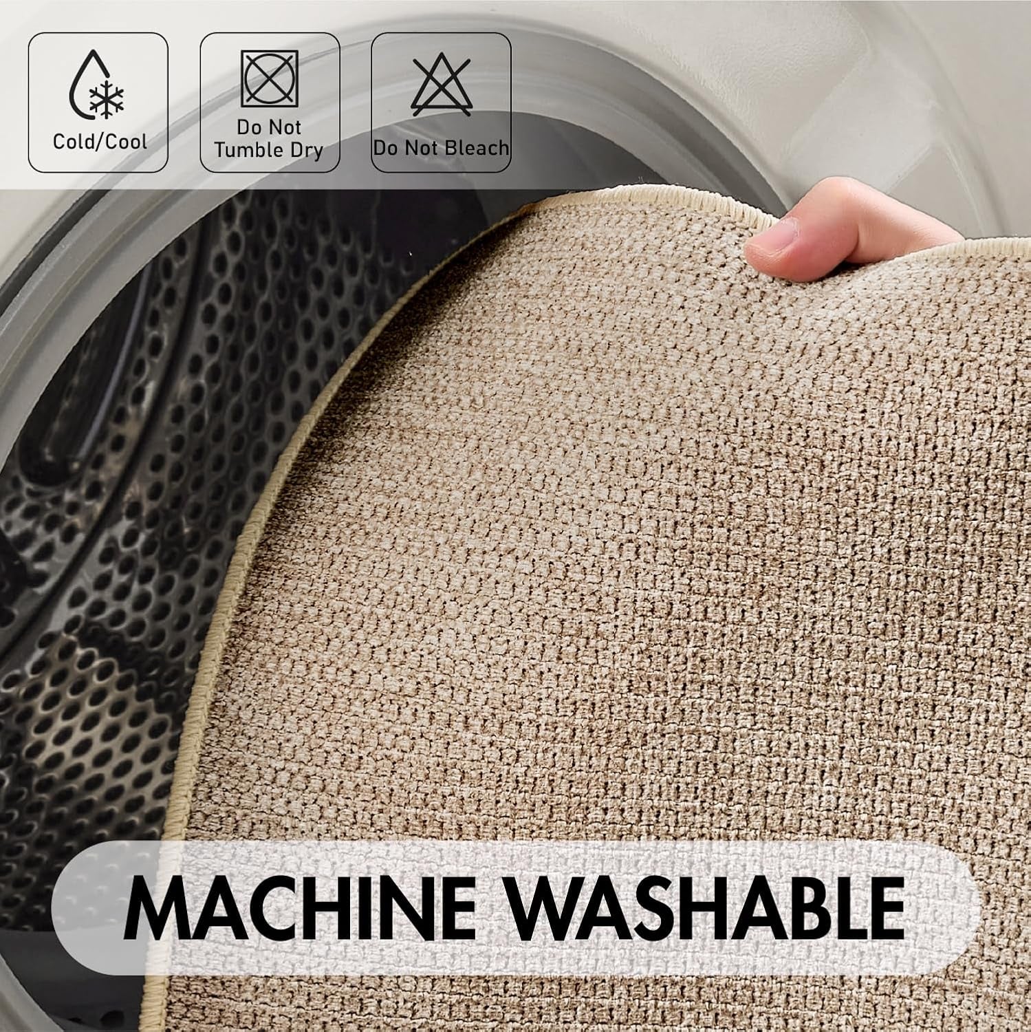 Hand holding corner of a beige bath mat inside a dryer drum to show fabric and weave.