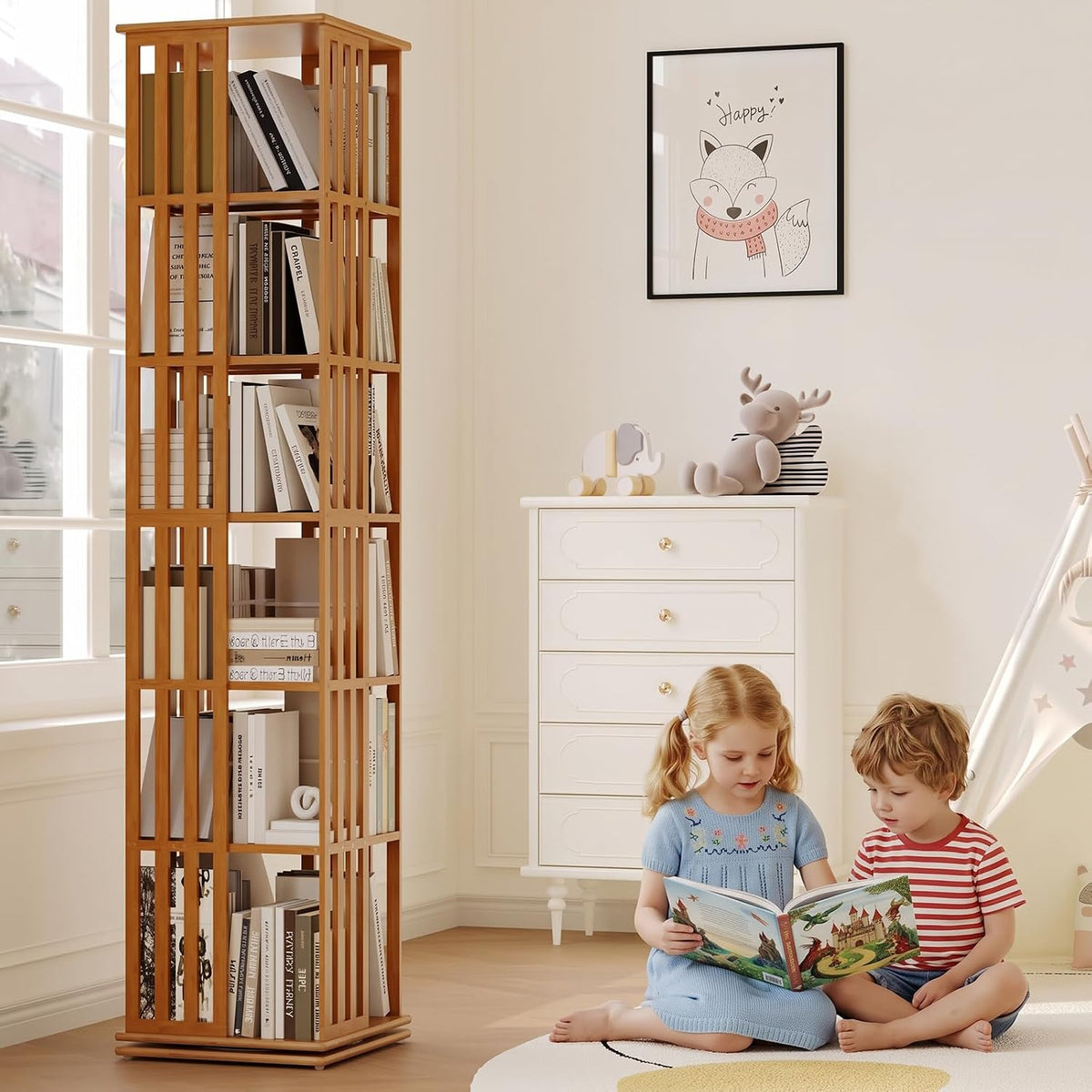 Tall bamboo rotating bookcase placed in a bright children's room beside a white dresser with two kids reading on the floor