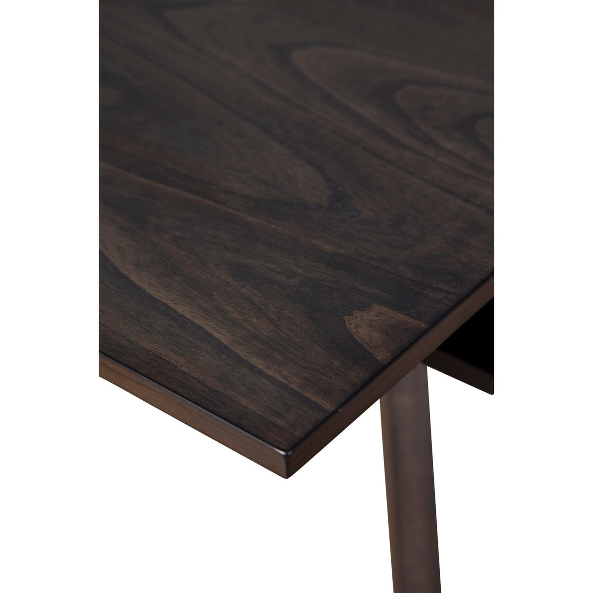 Close-up of the dark brown wood-grain tabletop and table edge