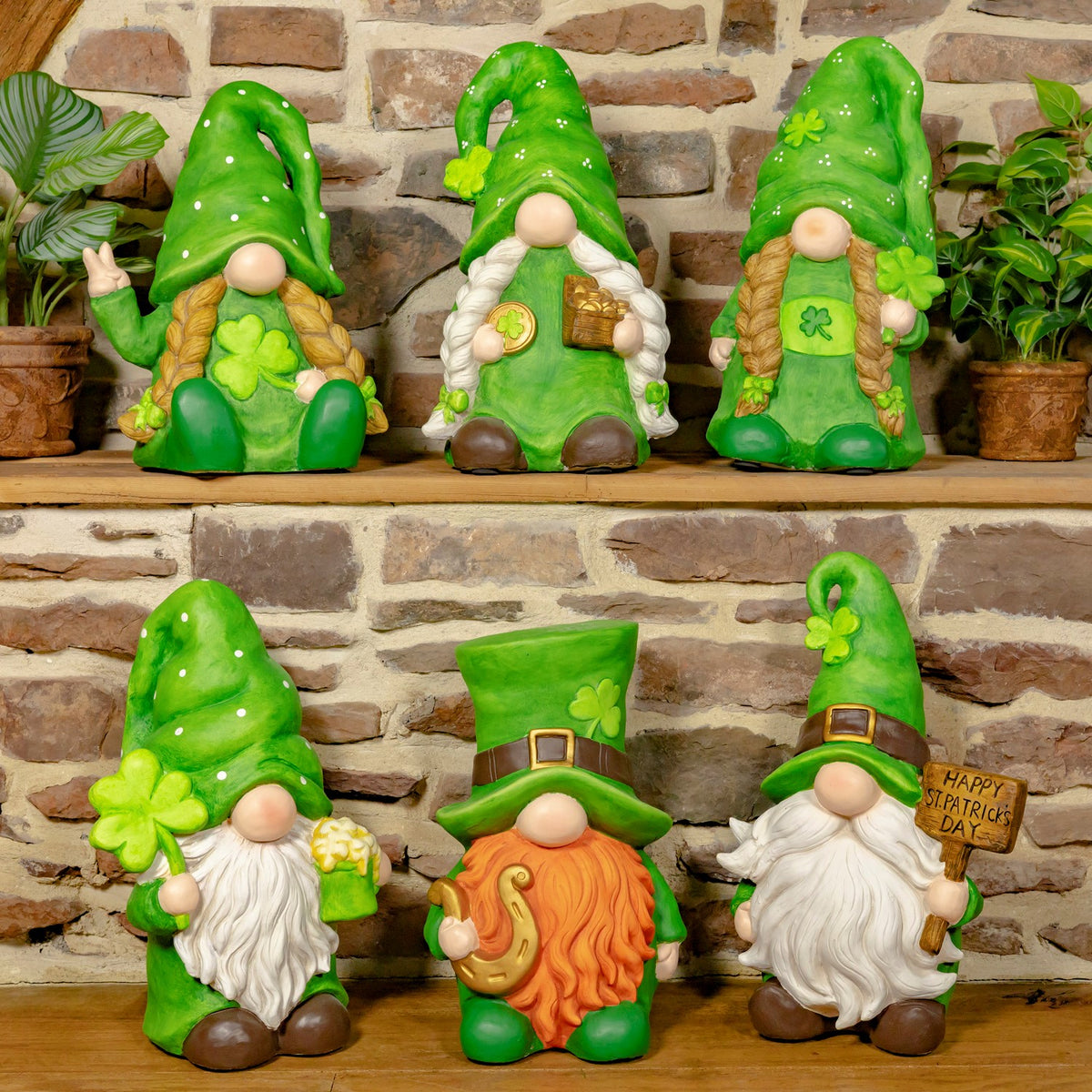 Six green St. Patrick’s Day gnomes with shamrocks, beards, and festive hats arranged on two shelves.