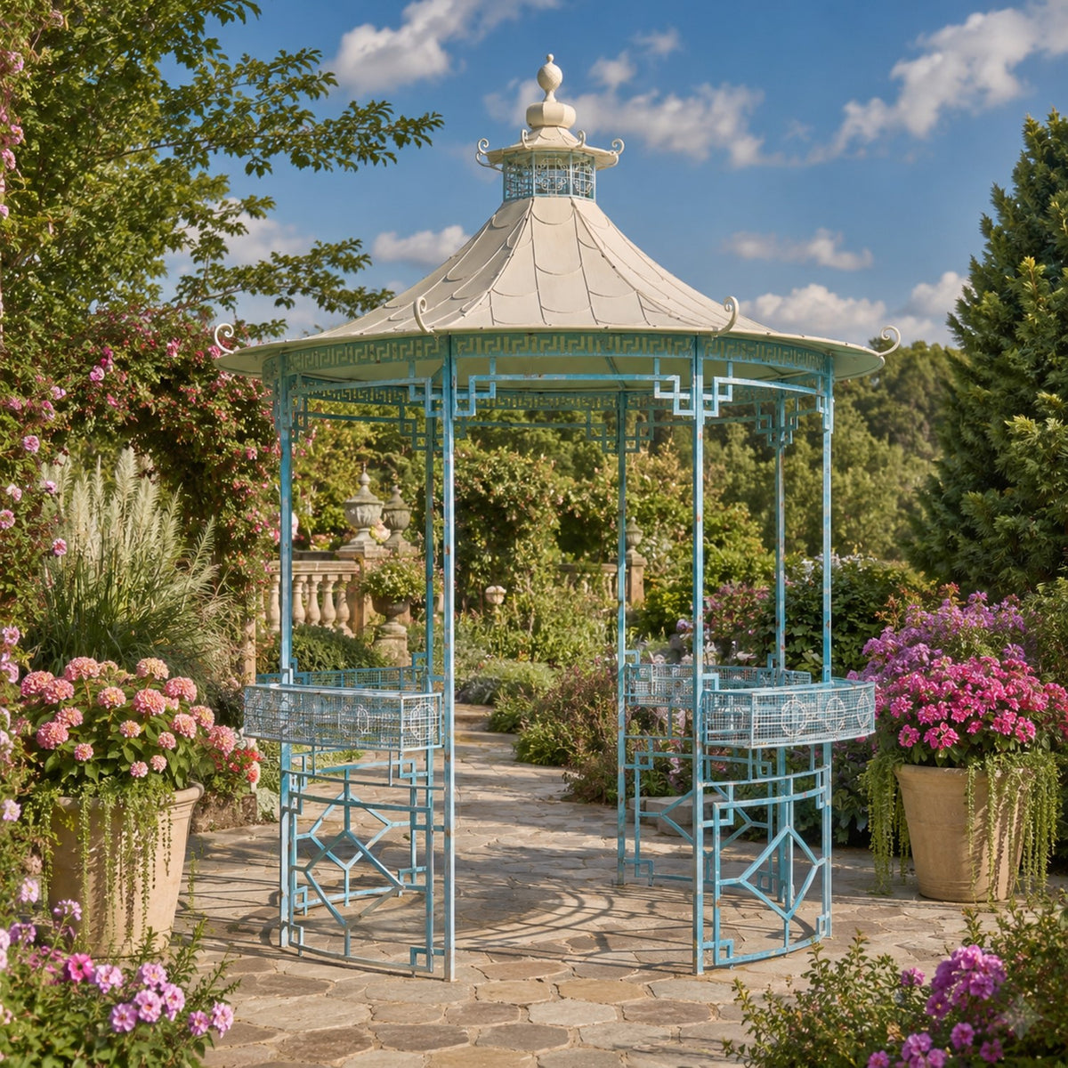 Light blue round iron gazebo with a pale roof, ornate metalwork and two built-in planters in a flower-filled garden.