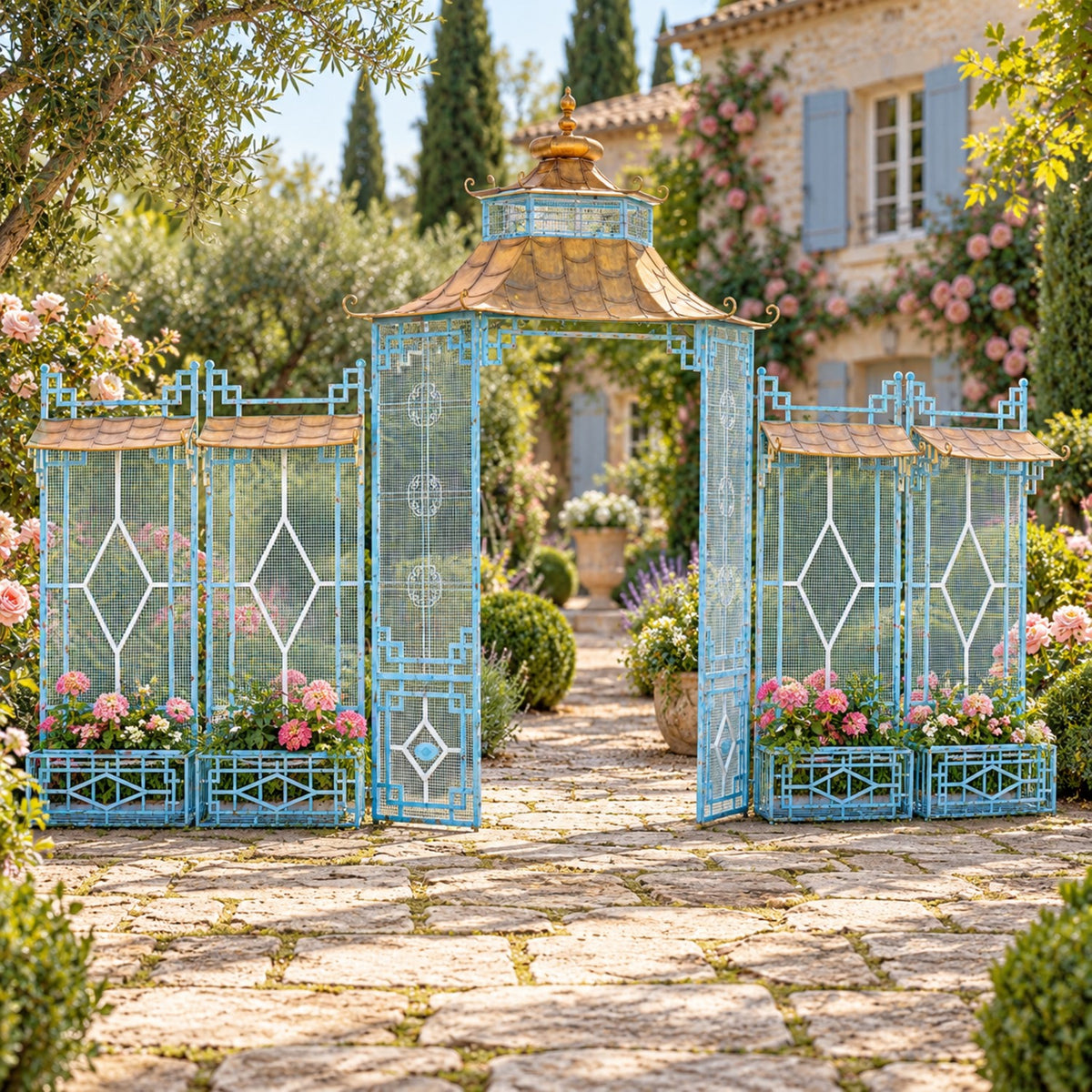 Ornate blue garden gate with a pagoda-style canopy and flower-filled planters framing a stone path.