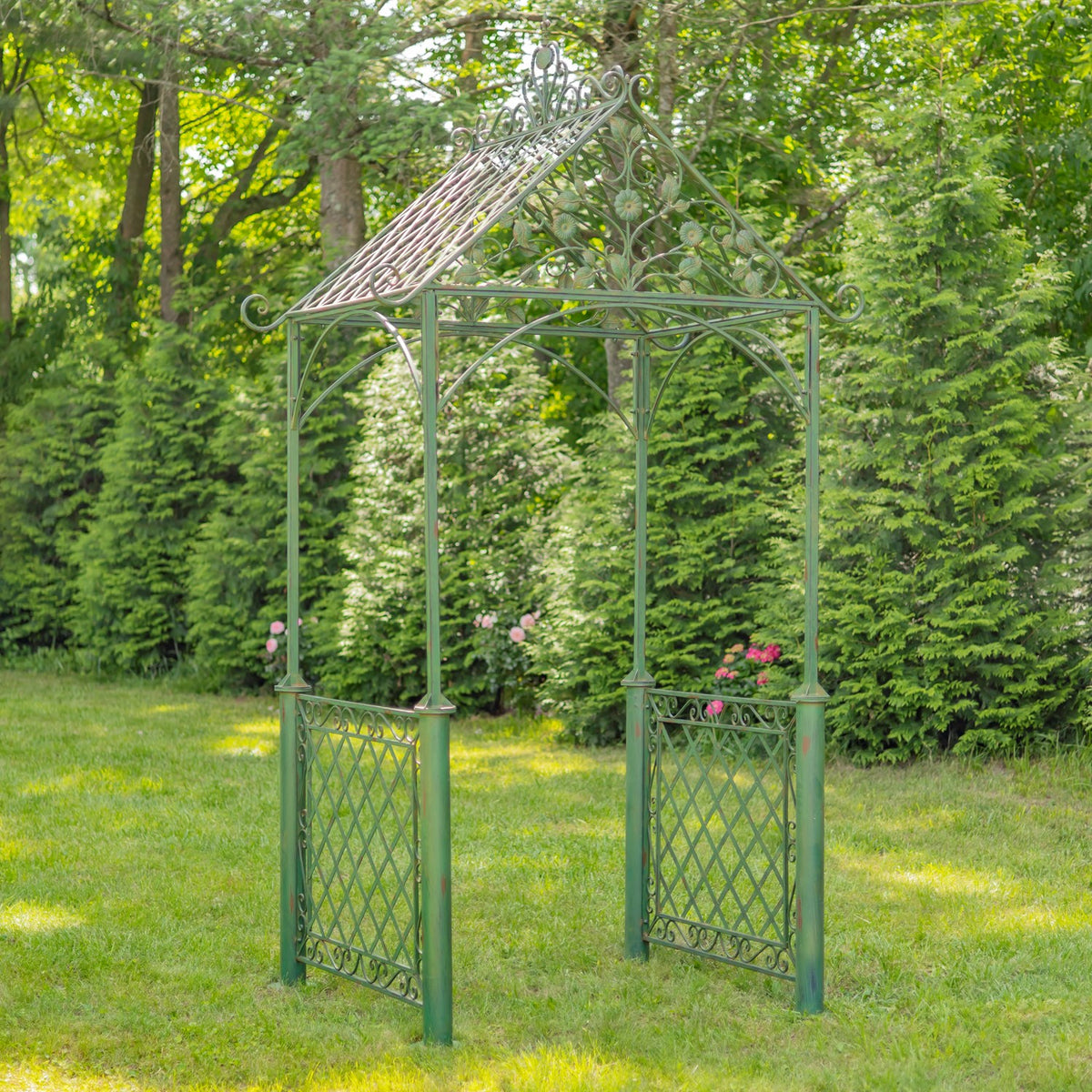 Garden arch seen from the front at an angle, showing its lattice side panels and curled roof details.