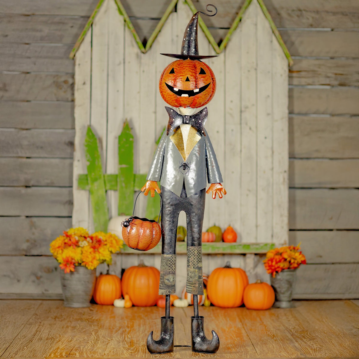 Full-length jack-o'-lantern gentleman in a top hat with a spider basket, front view