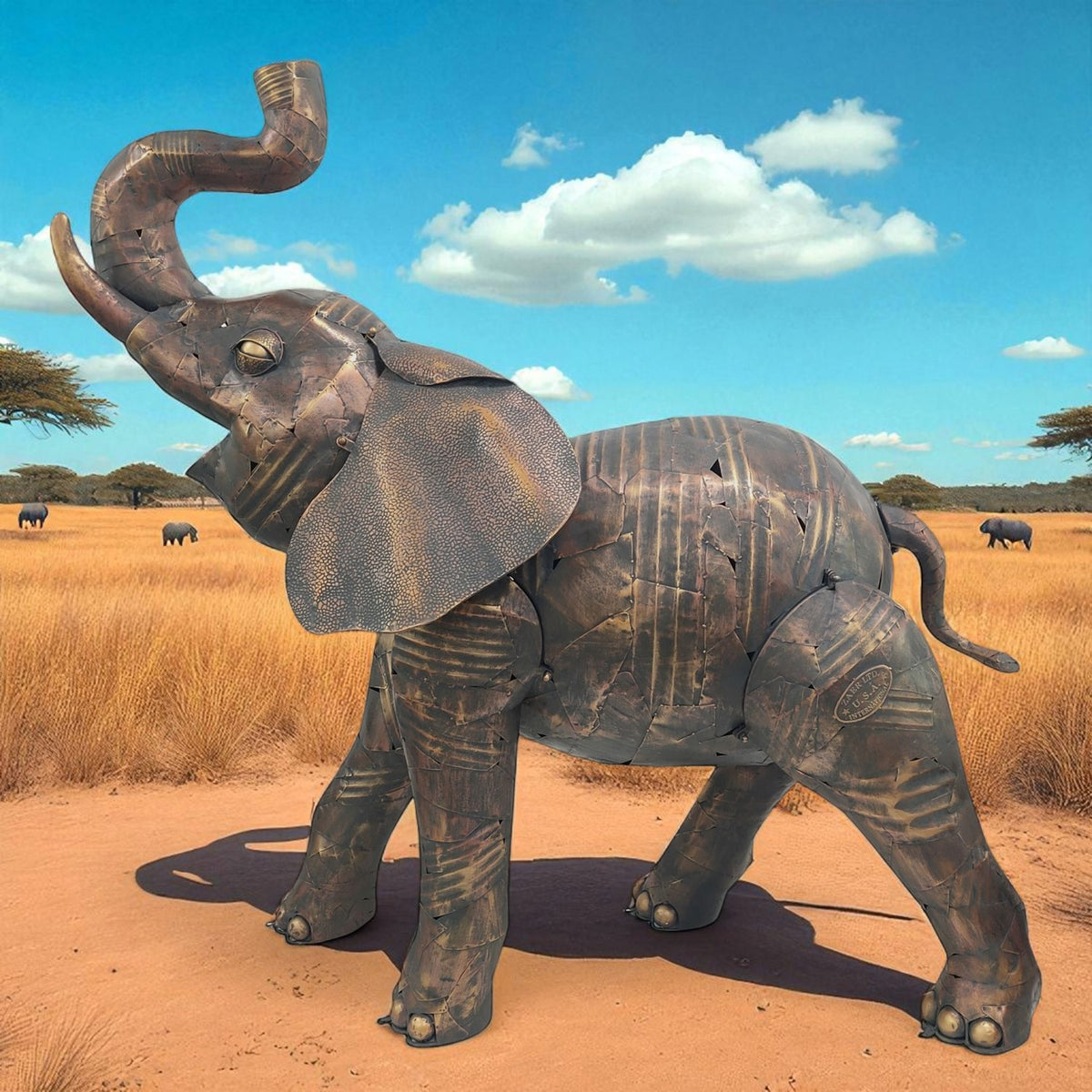 Distressed brown metal elephant statue outdoors against a savanna landscape