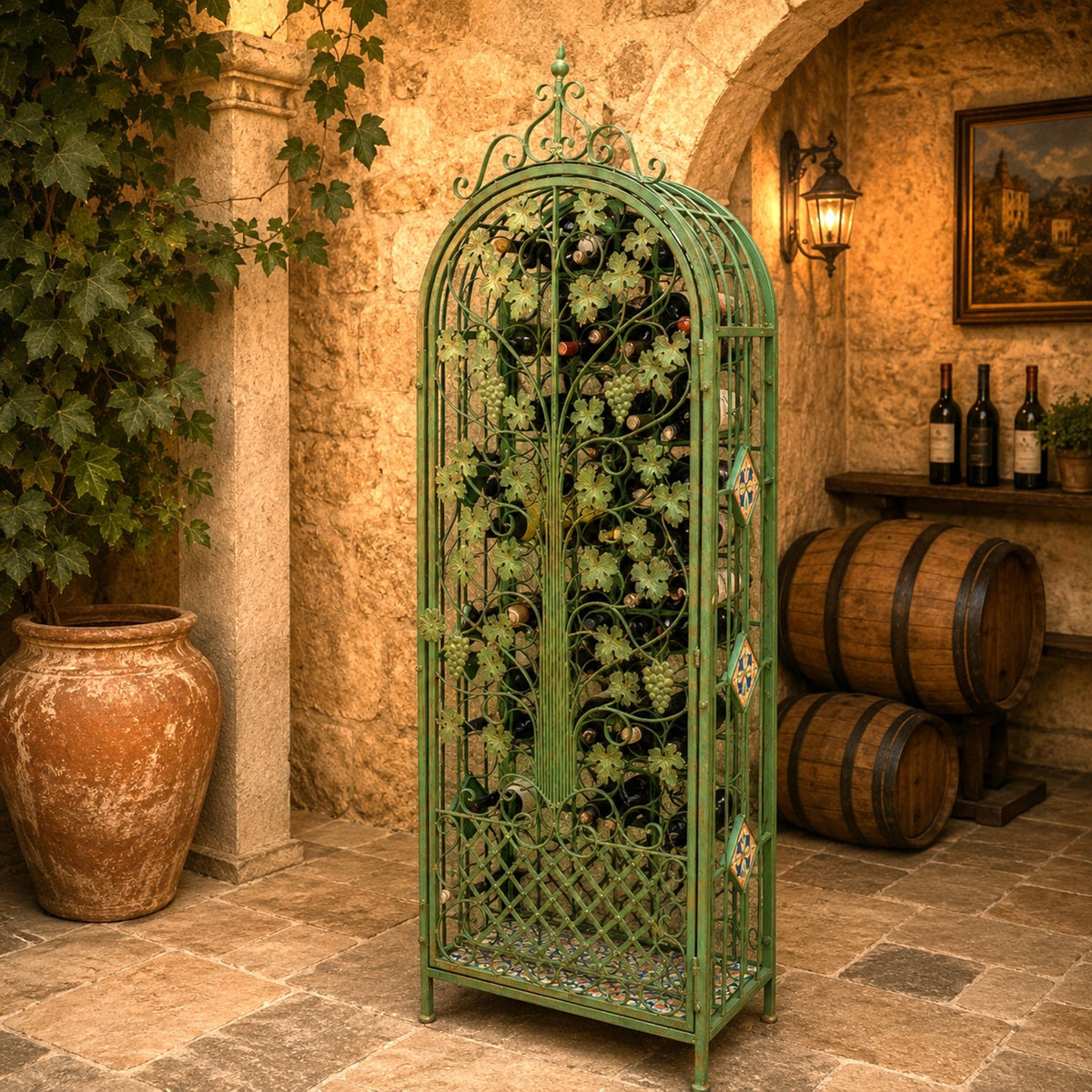 Tall green-brown arched iron wine rack in a rustic stone cellar, styled with grapevines and barrels.