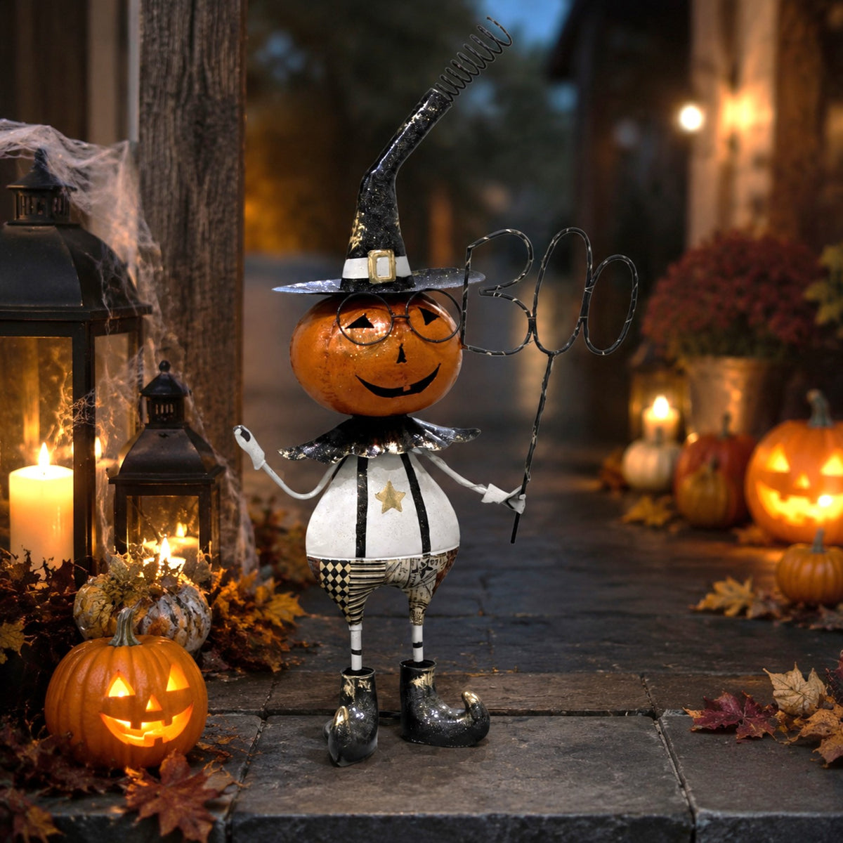 A pumpkin-headed Halloween figure in a witch hat holds a wire sign in a candlelit autumn scene.