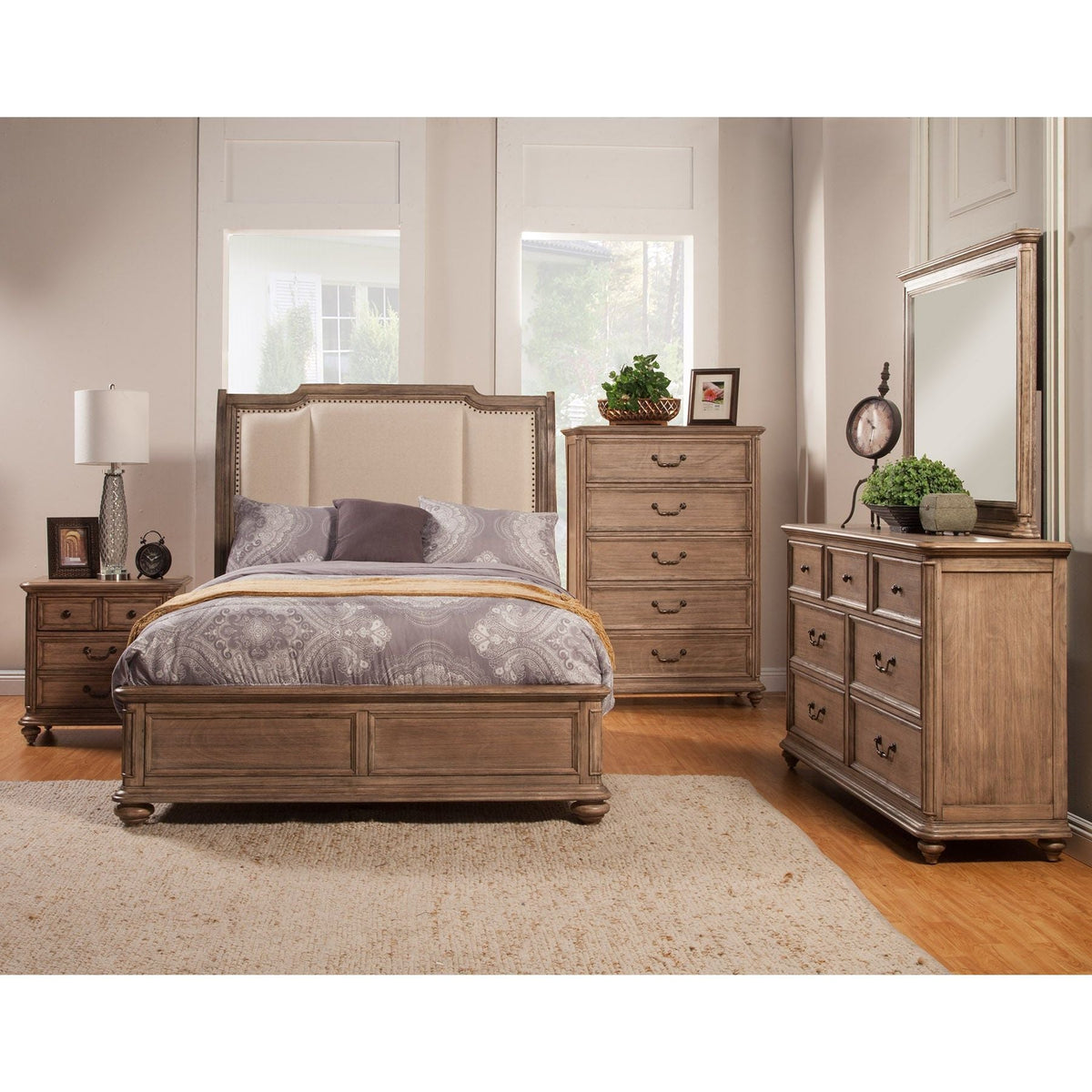 French Truffle bed with upholstered headboard in a furnished traditional bedroom