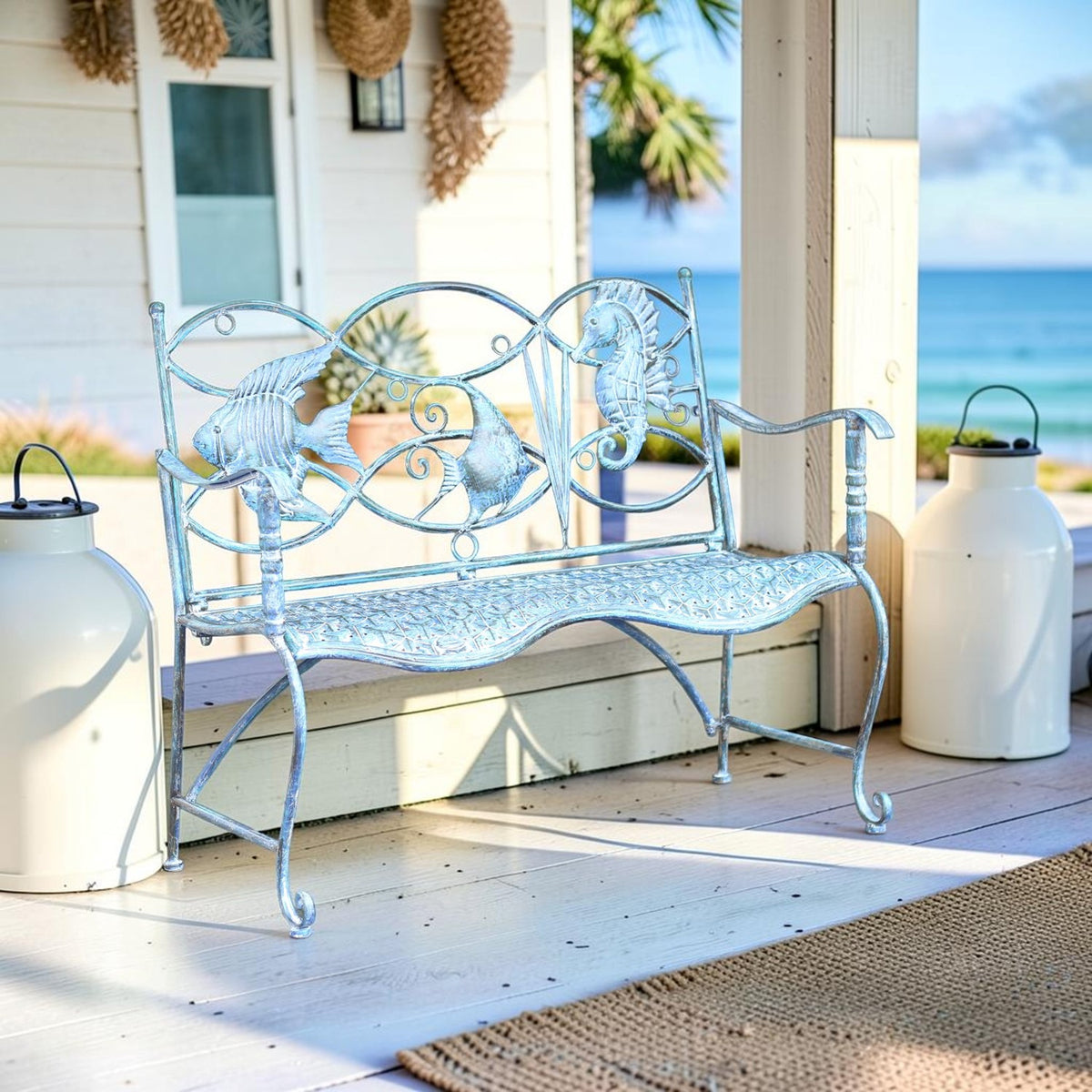 Coastal blue marine-themed iron bench shown on a porch beside lanterns