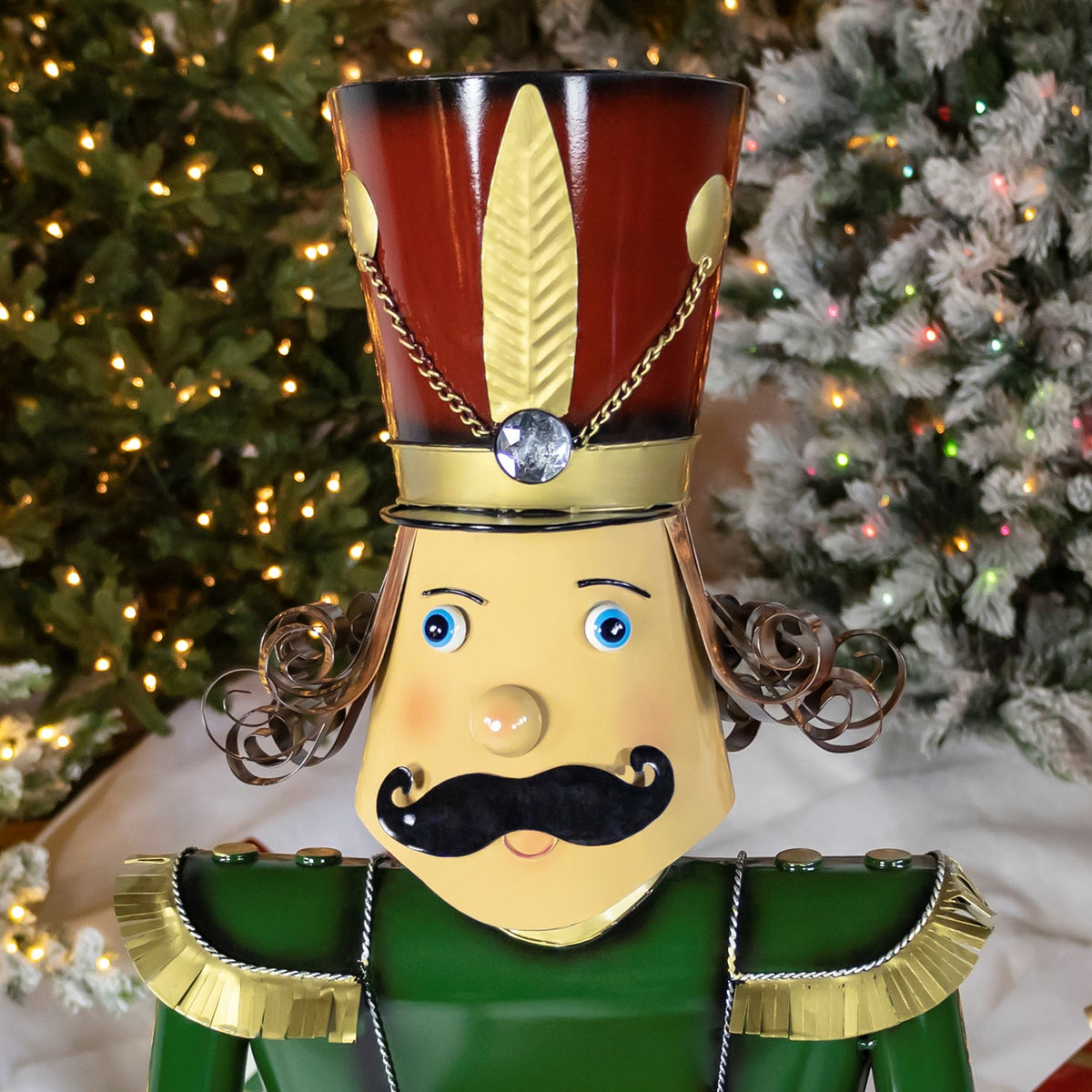 Close-up of the nutcracker's face, red hat and green uniform