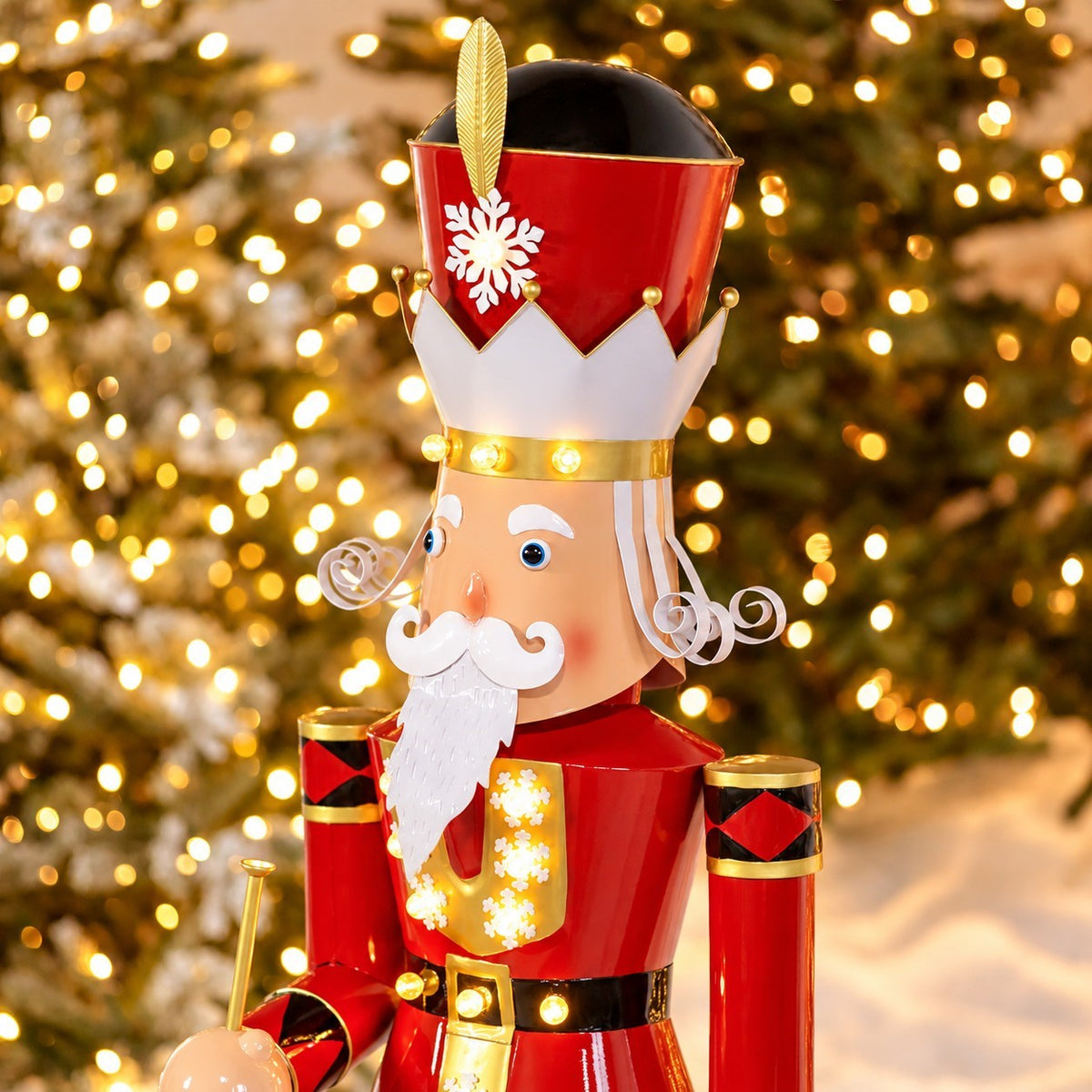 Close view of the nutcracker’s crown, curled white mustache, illuminated uniform, and trumpet.