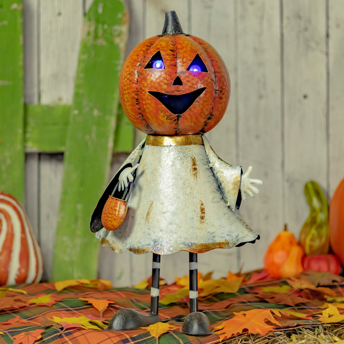 Front view of the orange pumpkin-headed ghost with a distressed white dress