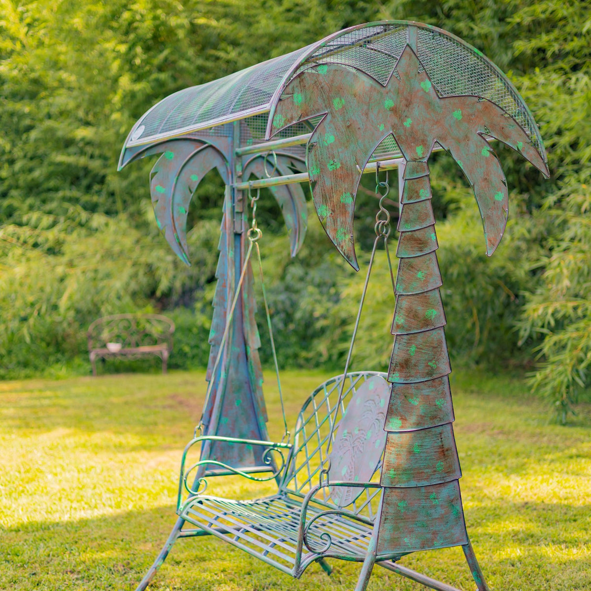 Angled outdoor view of the swing bench highlighting its palm-tree support