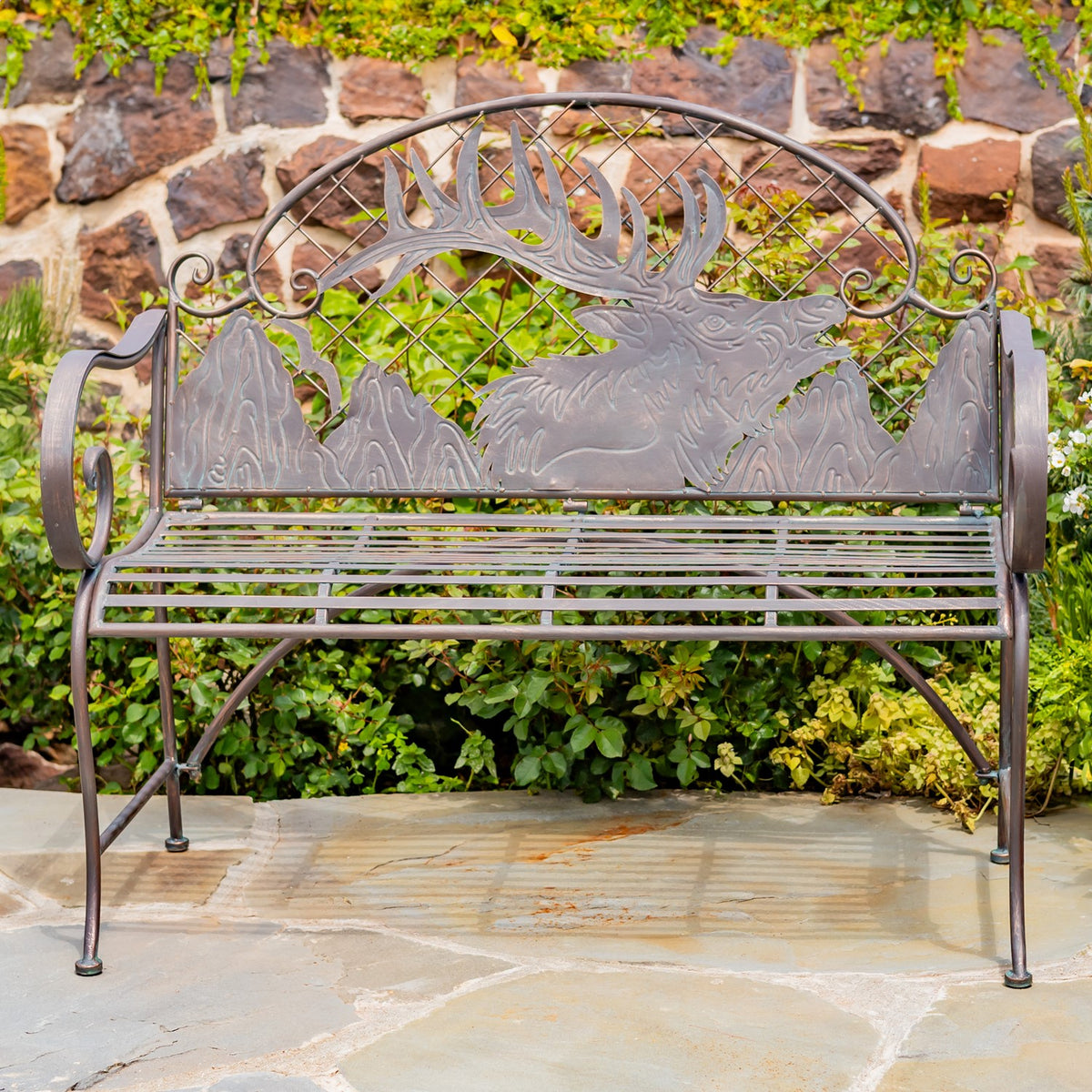 Front view of an iron garden bench showing its arched caribou backrest and curled armrests
