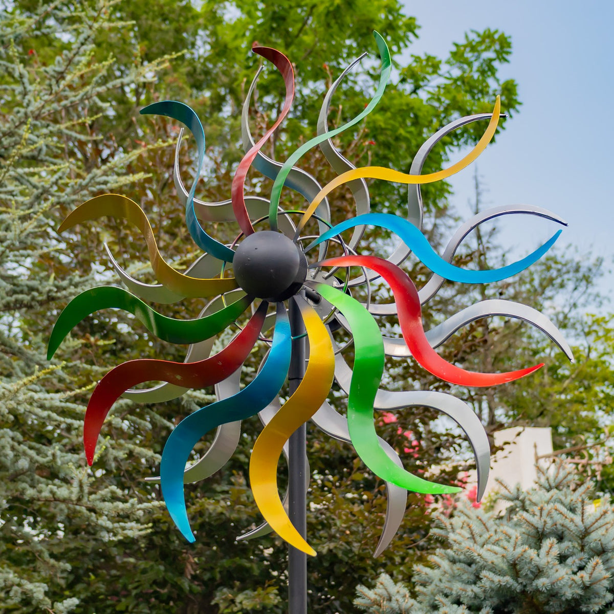 Close view of the spinner’s multicolored curled blades around a dark central hub.