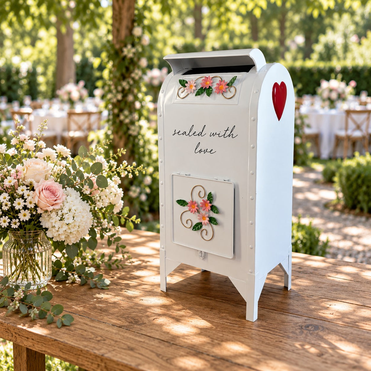 Glossy white wedding mailbox angled to show its side and red heart