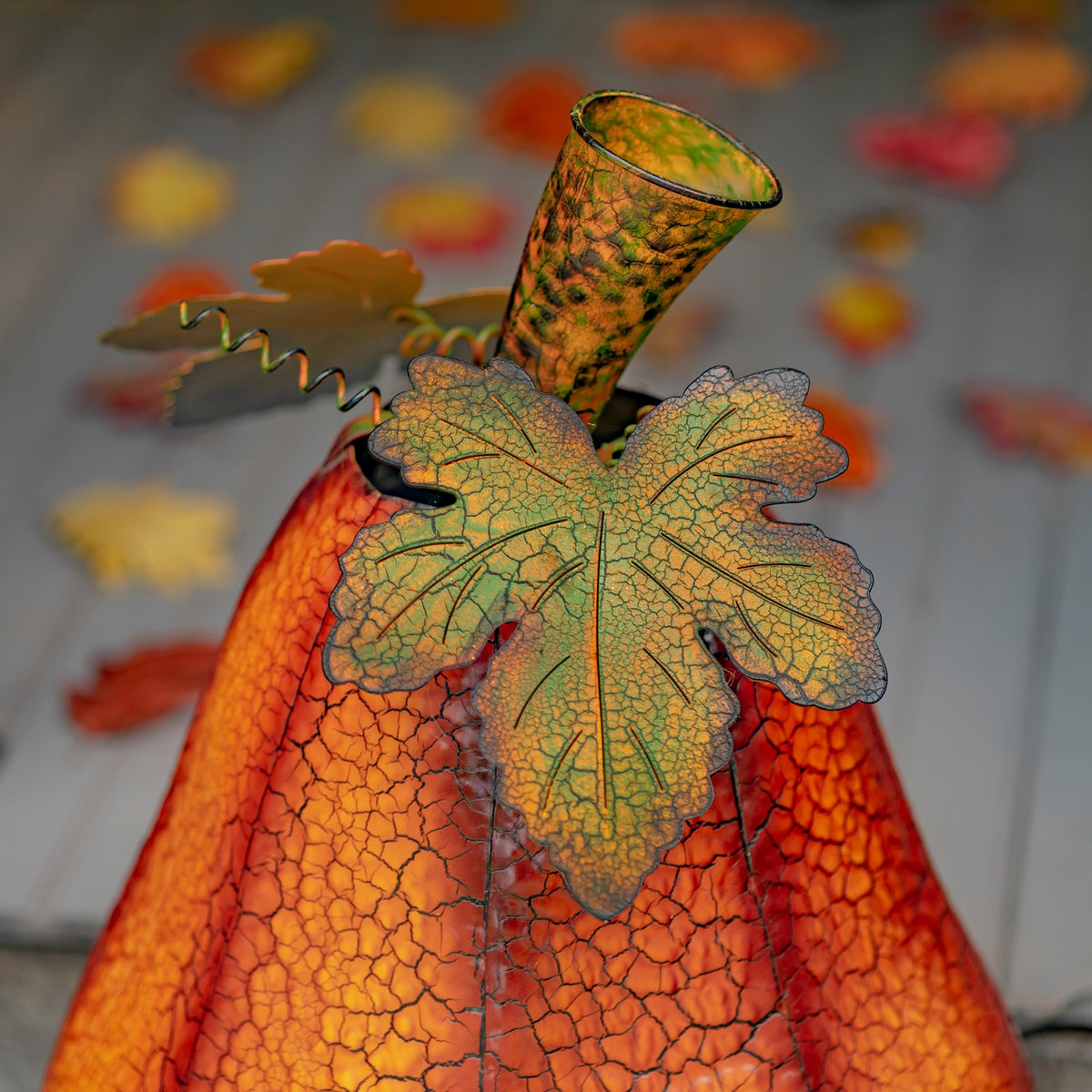 Close-up of the jack-o'-lantern's metal leaf and stem detail