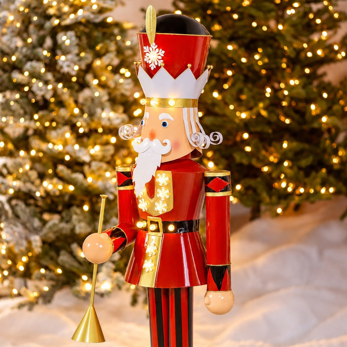 Nutcracker shown from the side with its trumpet hanging beside the red uniform and striped trousers.