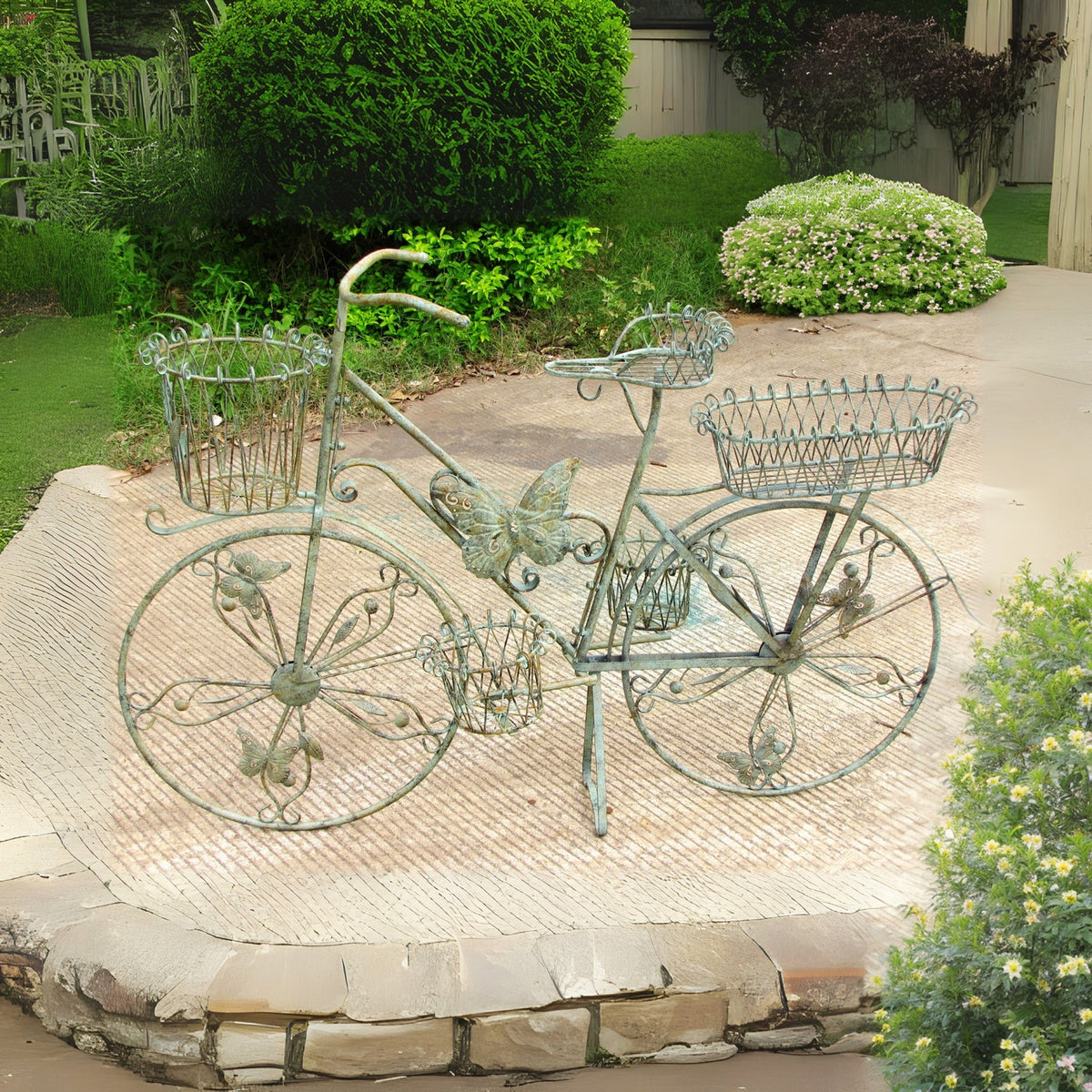 Side view of the decorative bicycle stand on a paved patio, showing its baskets, spoked wheels, and butterfly details.