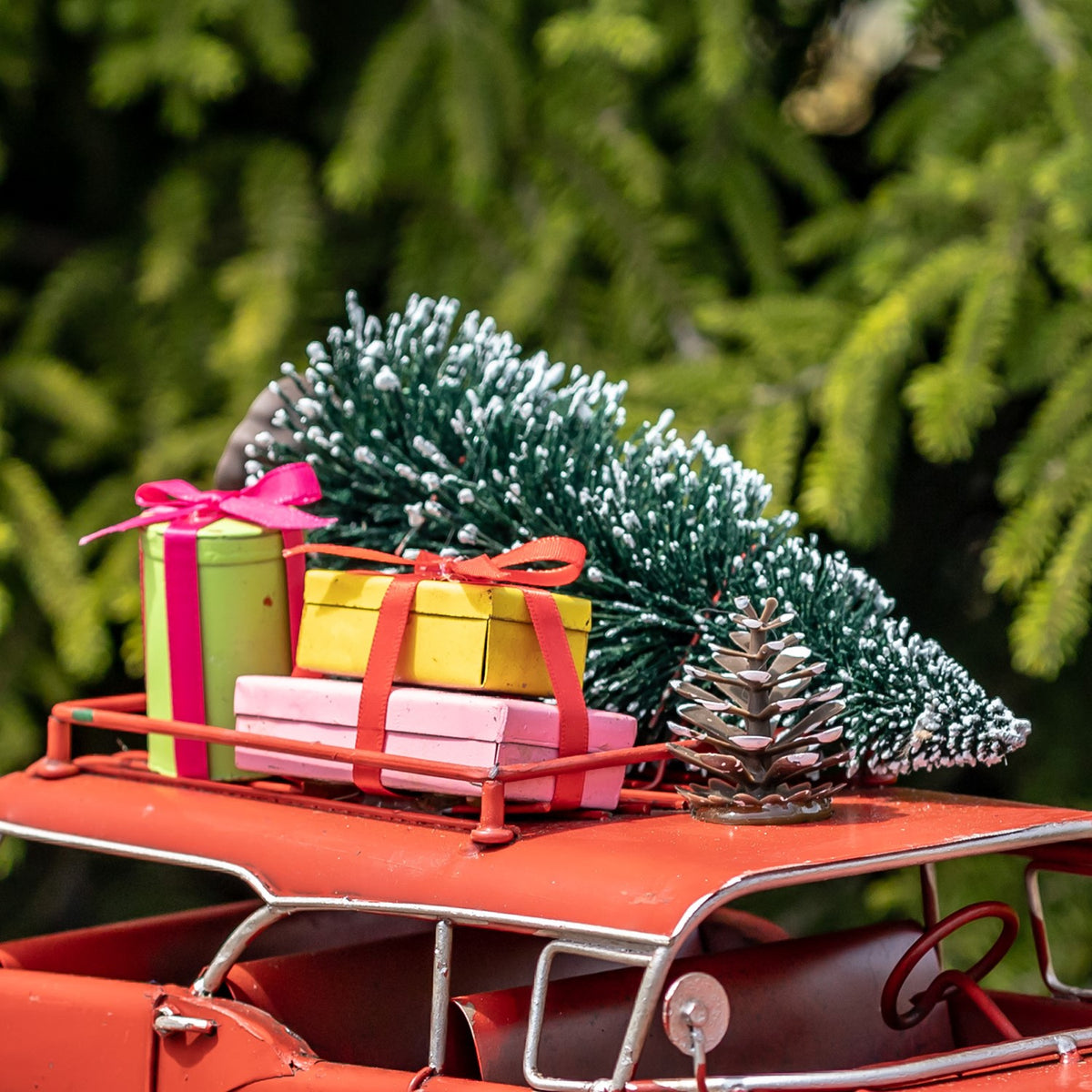 Close view of the roof display with a flocked tree and colorful gifts