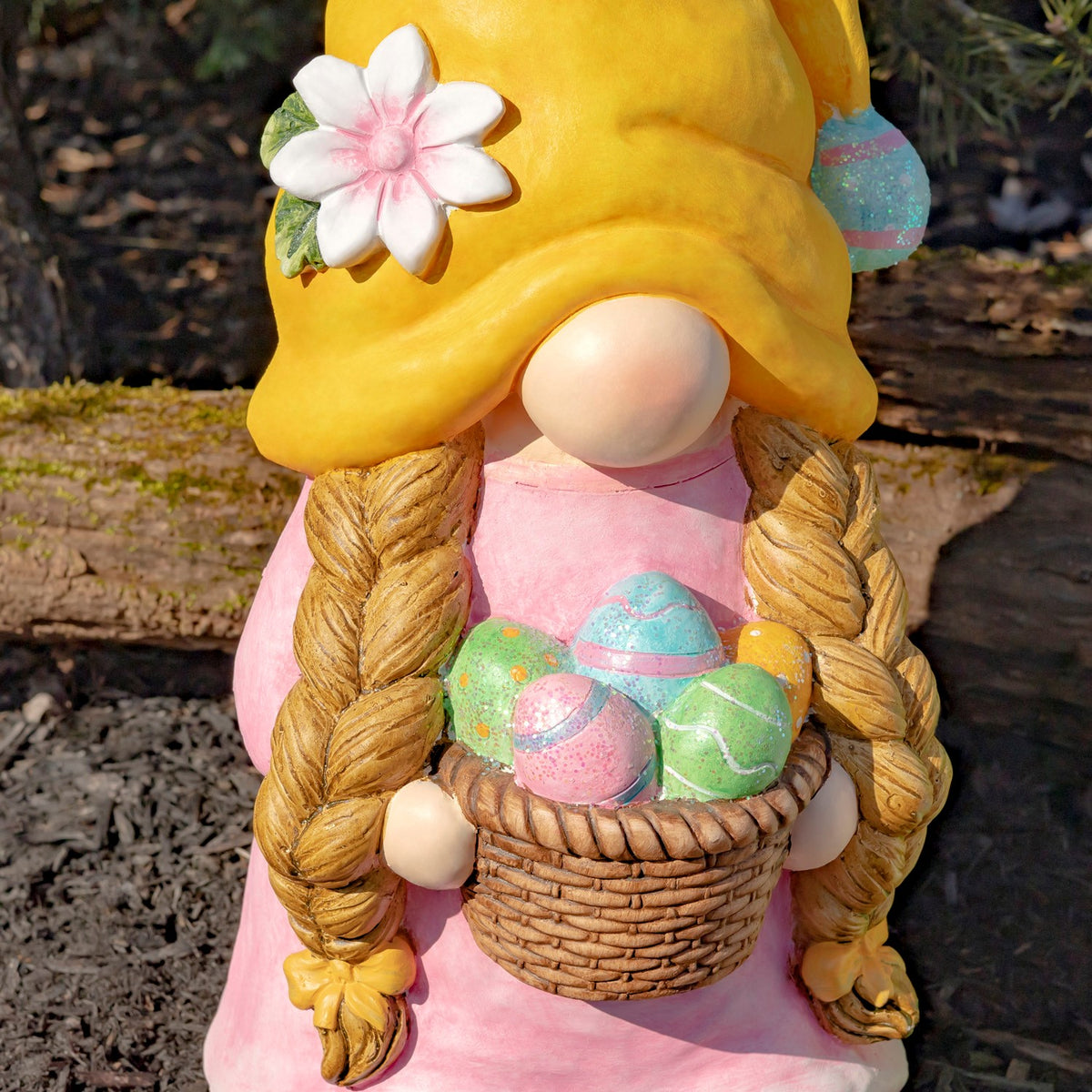 Close view of braided gnome in a yellow hat holding a basket of colorful Easter eggs