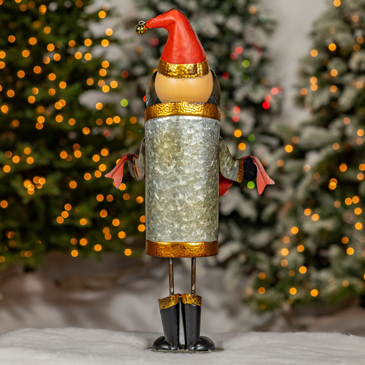 Rear view of Santa figurine showing distressed silver-tone finish