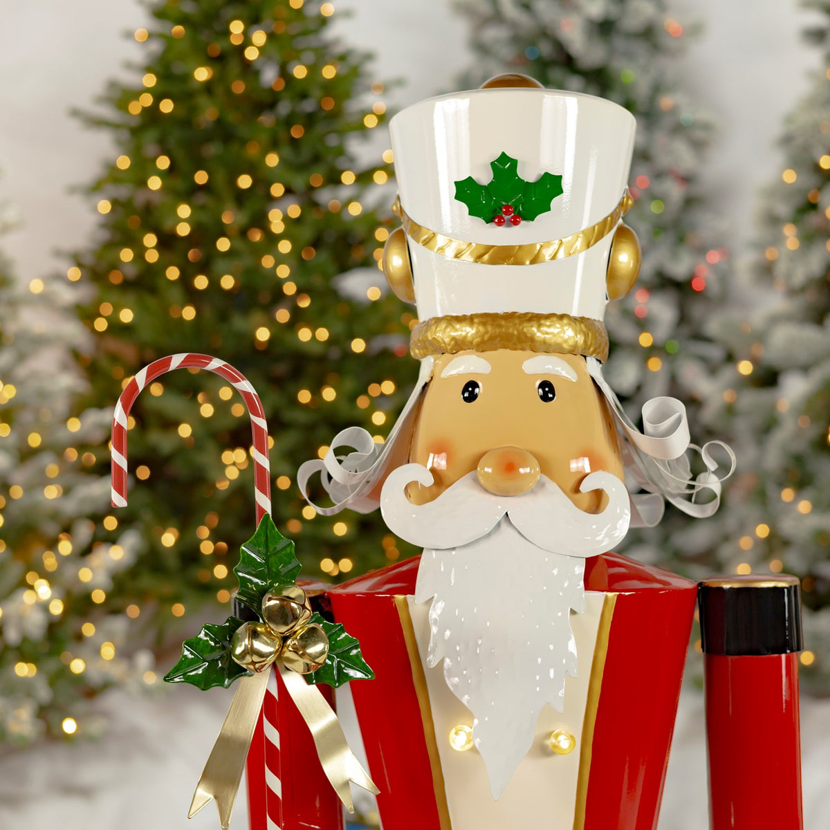 Close-up of the nutcracker’s holly-trimmed hat, curled mustache, beard, and candy cane decoration.