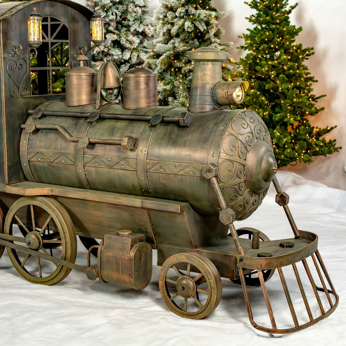 Close view of the locomotive's ornate iron boiler and rotating wheels