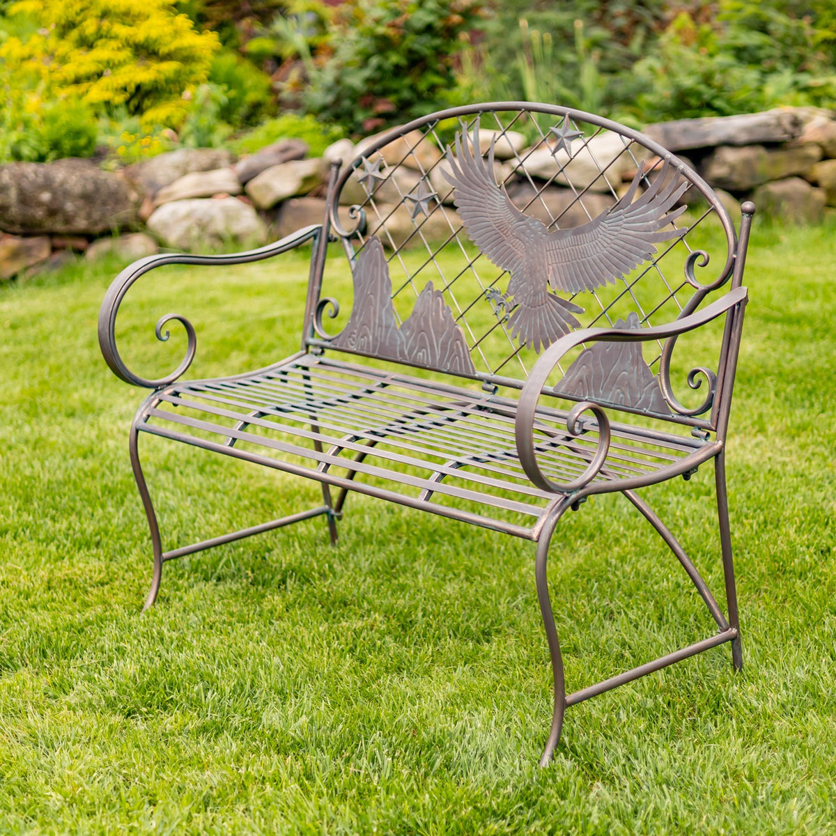 Three-quarter view showing the bench’s slatted seat, curved legs, and decorative eagle backrest.