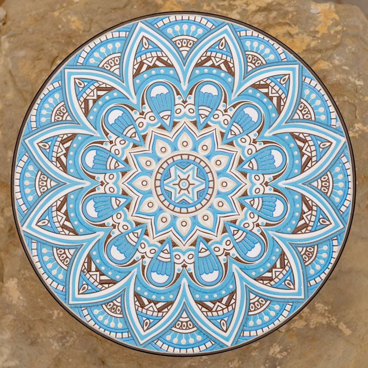 Overhead view of the trolley's circular blue, white, and brown decorative pattern.