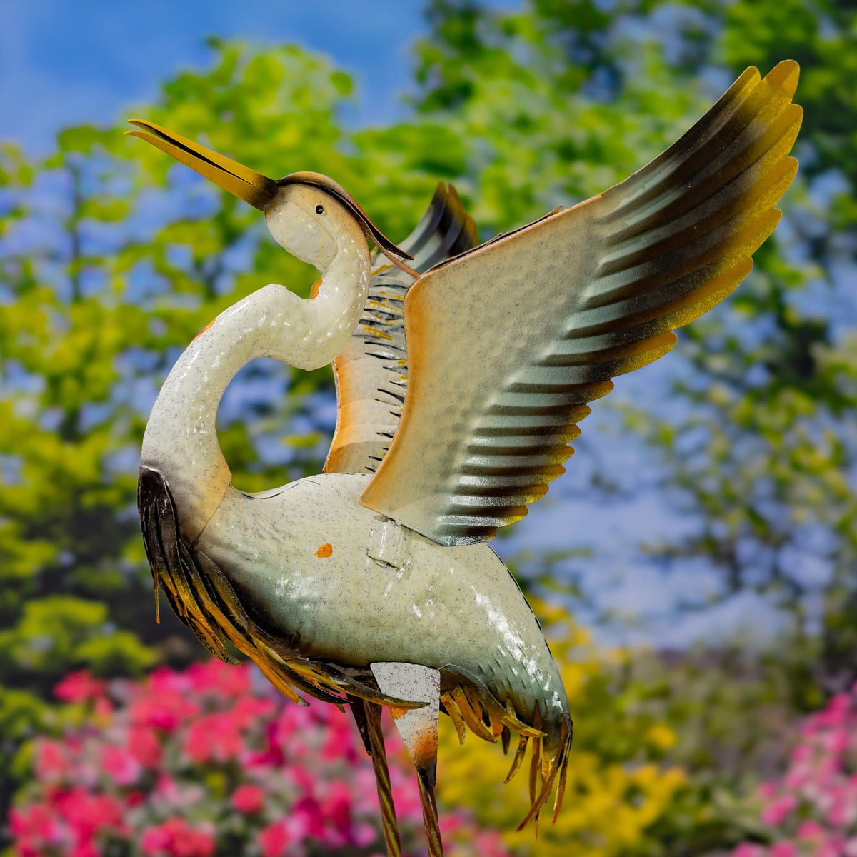 A single crane figurine shown from the side with one broad wing raised and its long legs visible.