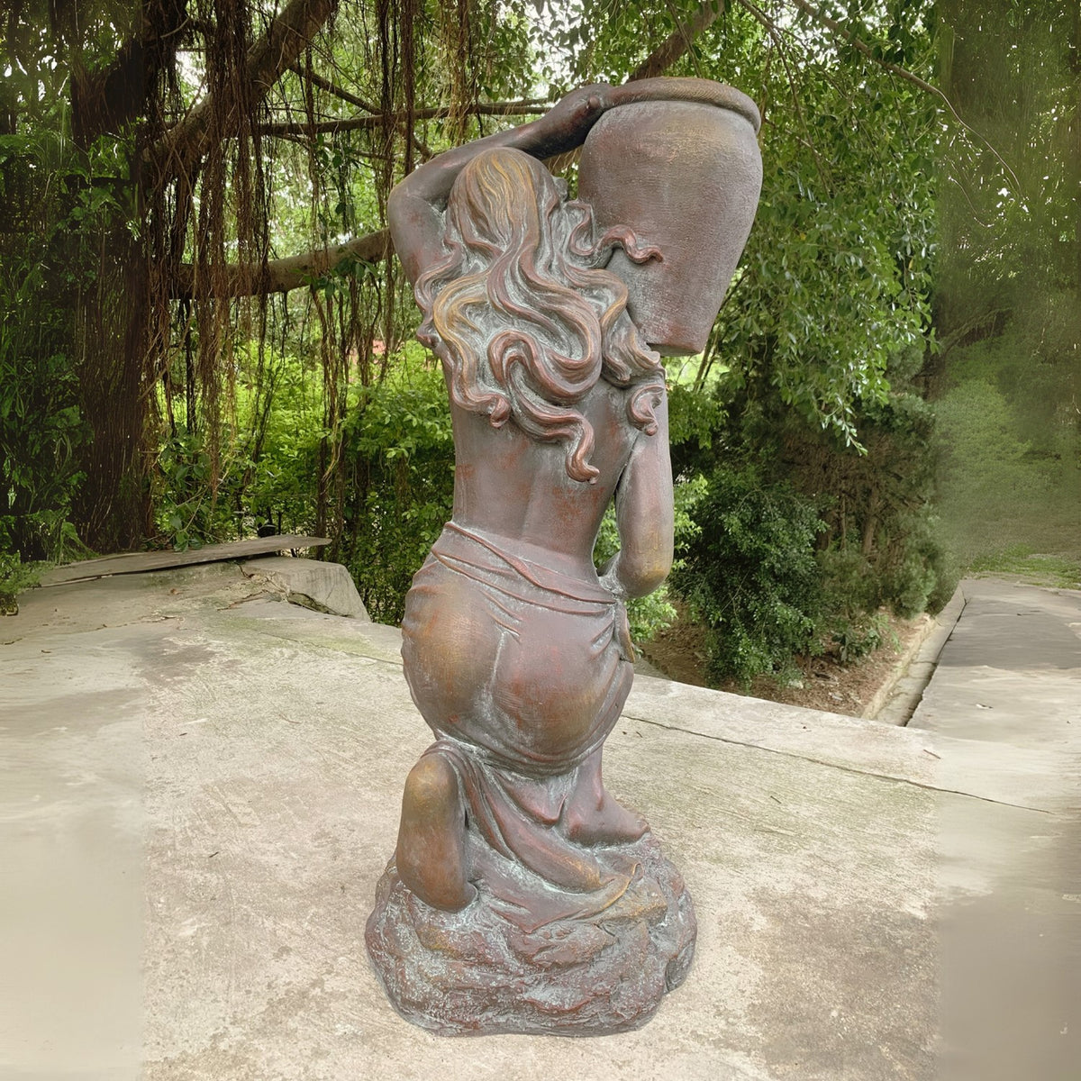 Rear view showing the statue’s wavy hair and urn held above her shoulder.