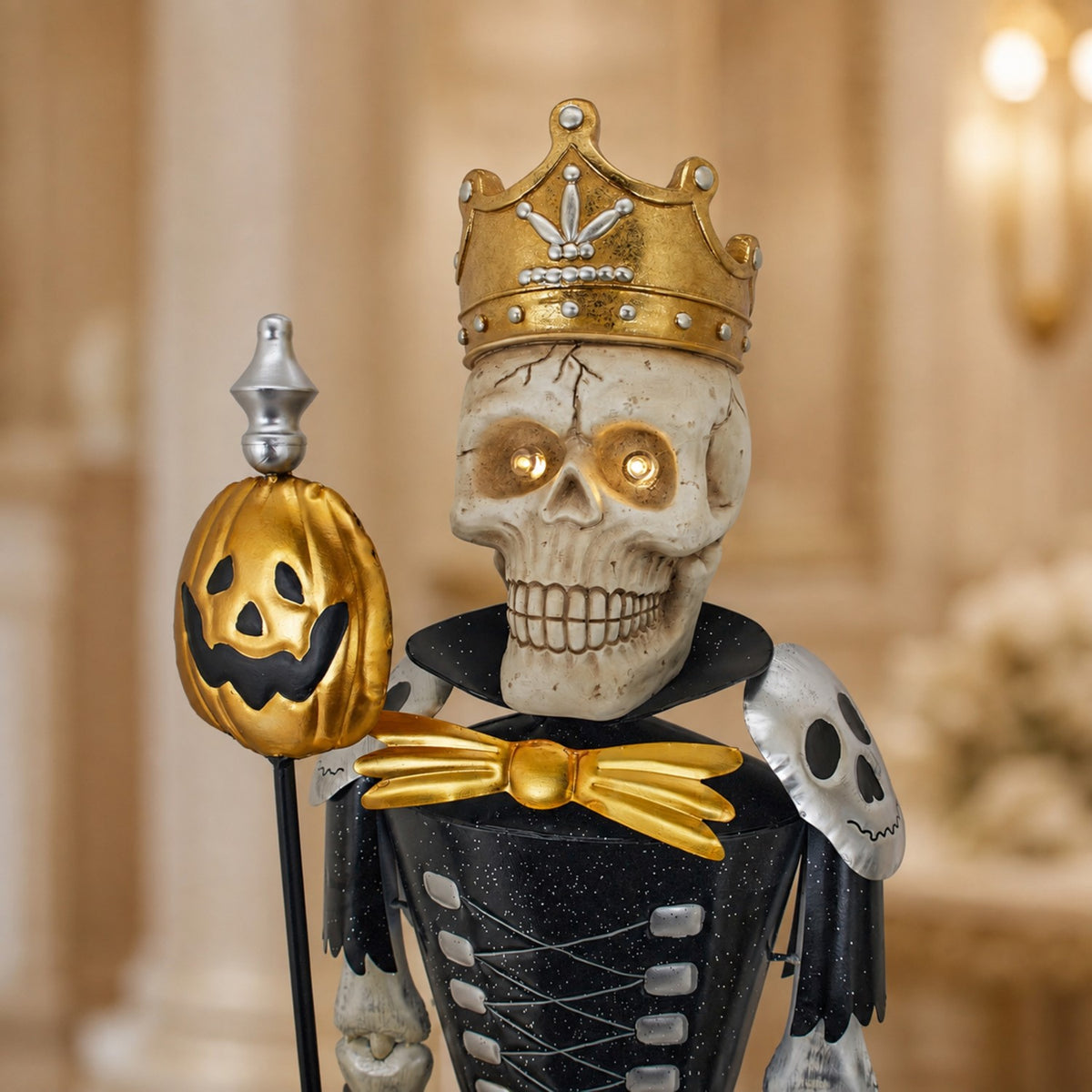 Front close-up of a crowned skeleton sentry holding a gold pumpkin staff