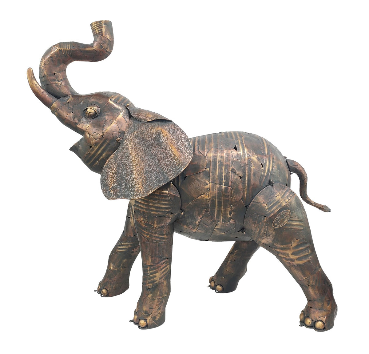 Distressed brown metal elephant statue in a side view on white