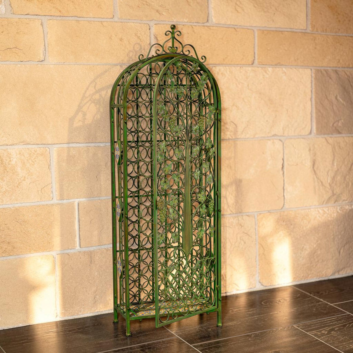 Angled view showing the wine rack's narrow sides, decorative ironwork, and arched top.
