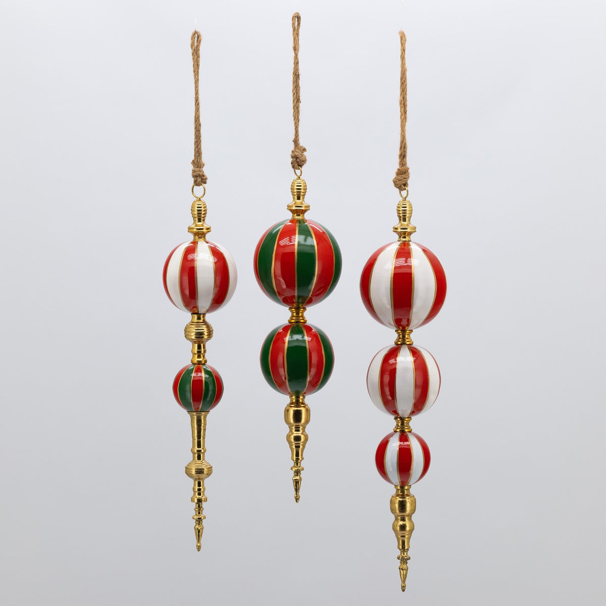 Three red, green, and white striped ornaments shown hanging against a plain light background.