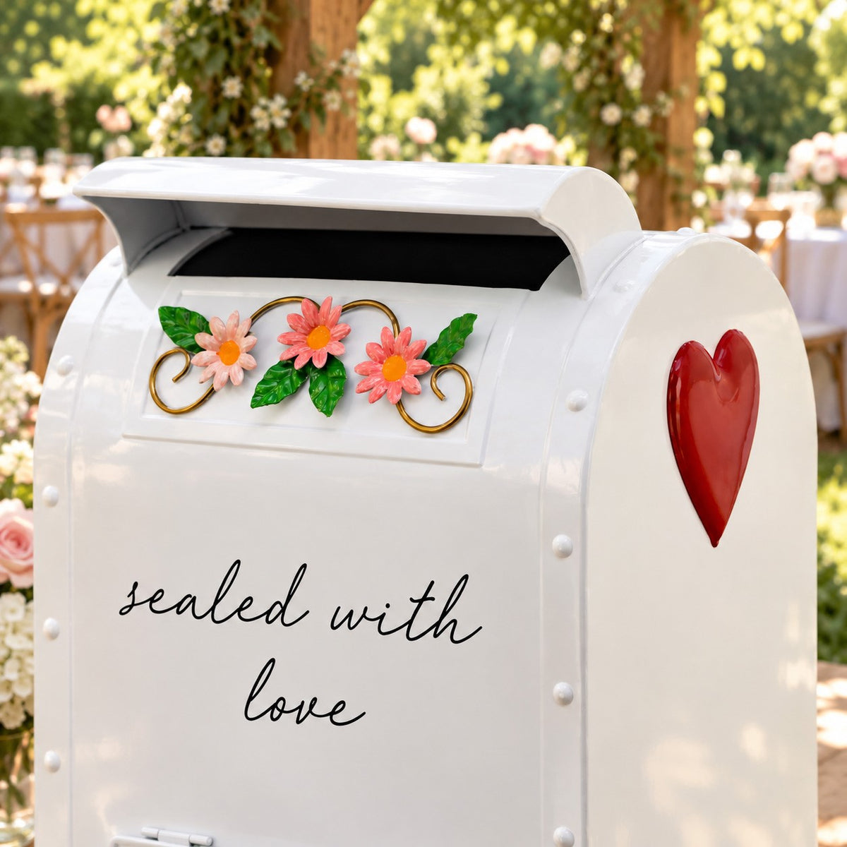 Close-up of the mailbox front with floral accents and a red heart