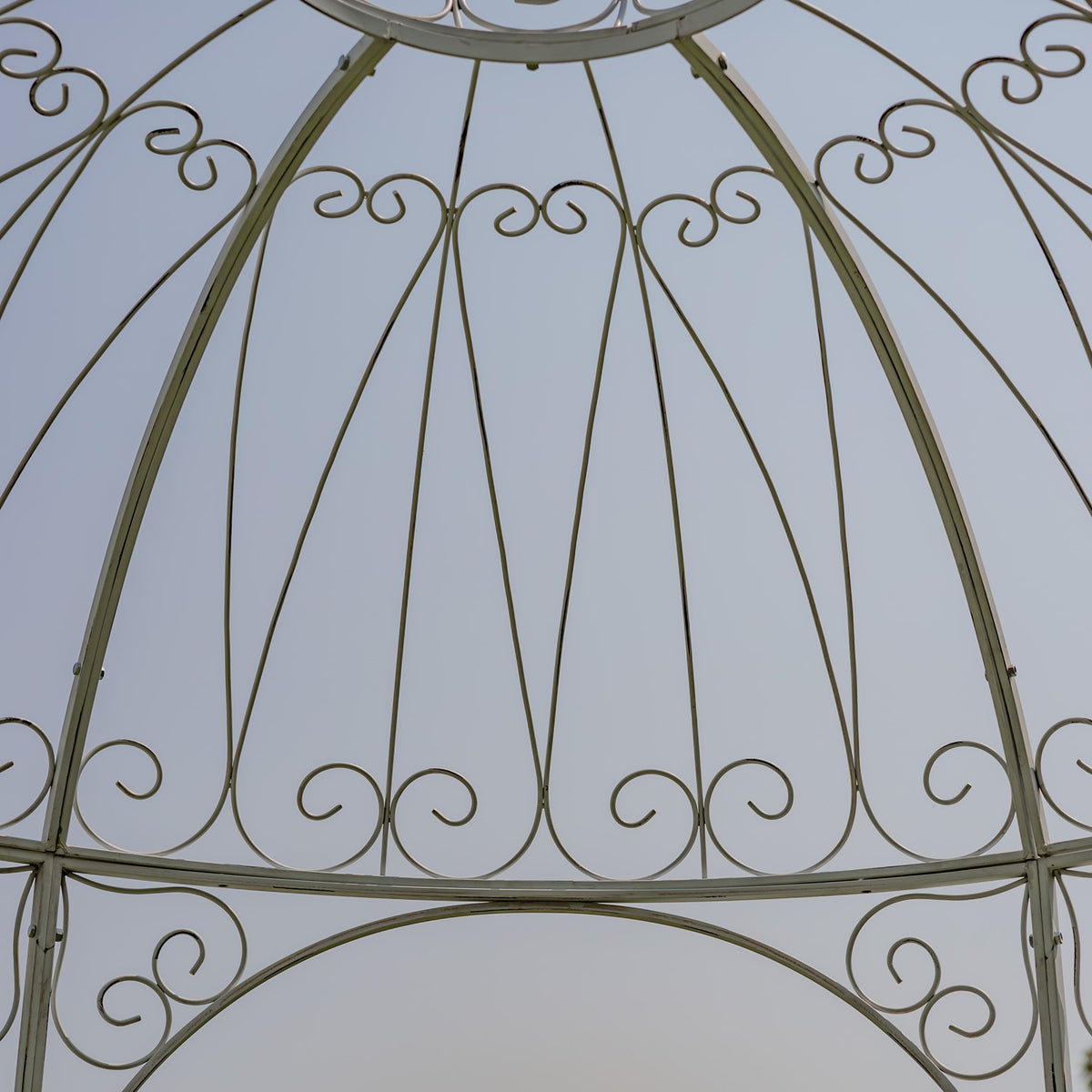 Close-up of bronze iron scrollwork across the domed roof