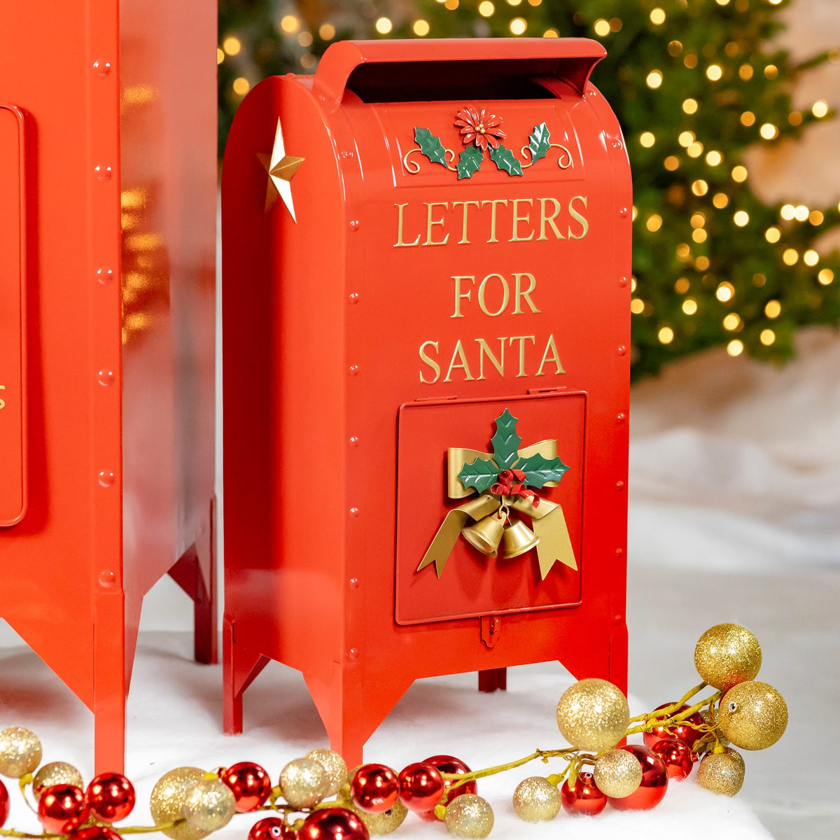 Medium glossy red Christmas mailbox with gold accents and a decorated front door